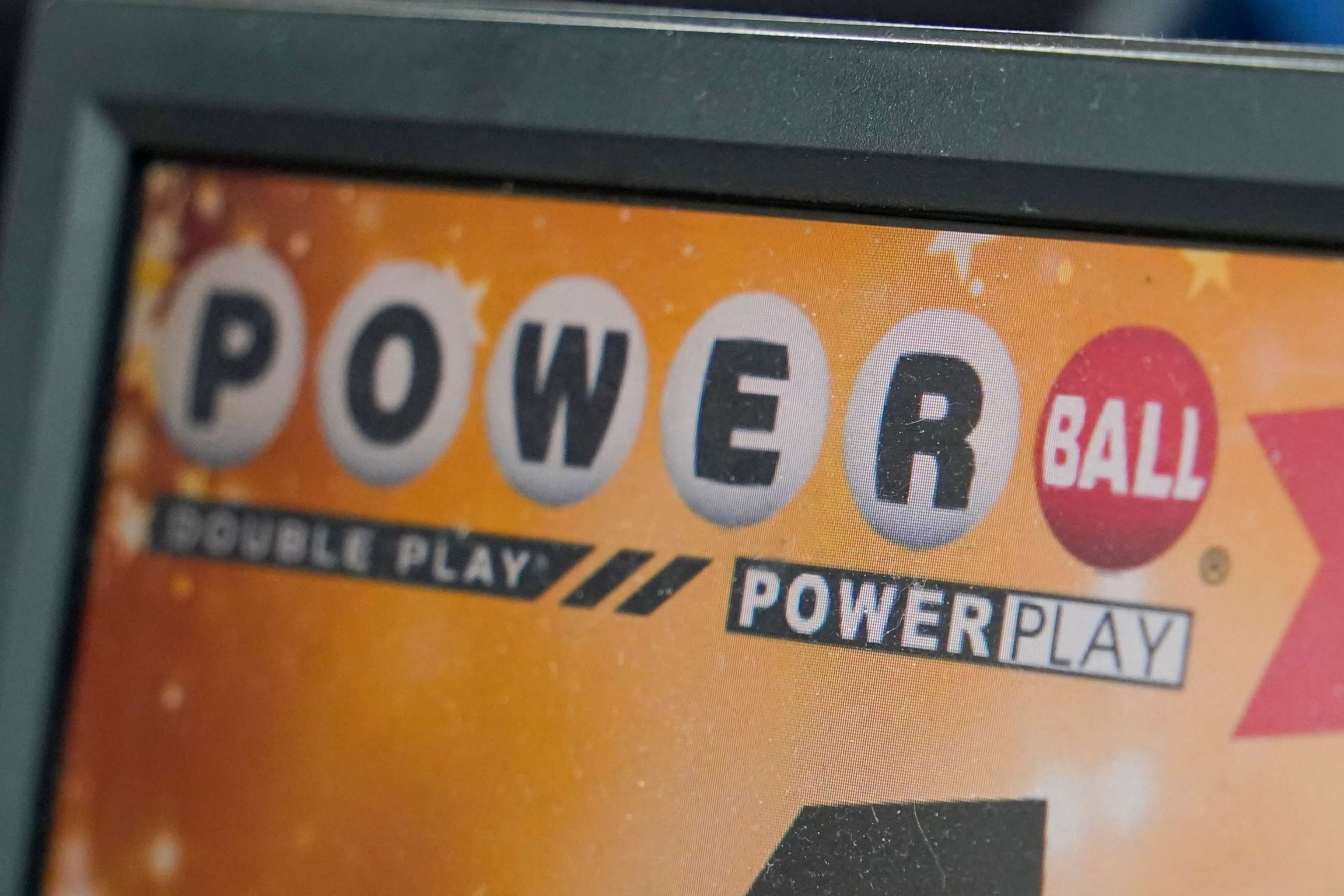 PHOTO: In this Nov. 7, 2022, file photo, a display panel advertises tickets for a Powerball drawing at a convenience store in Renfrew, Pa.