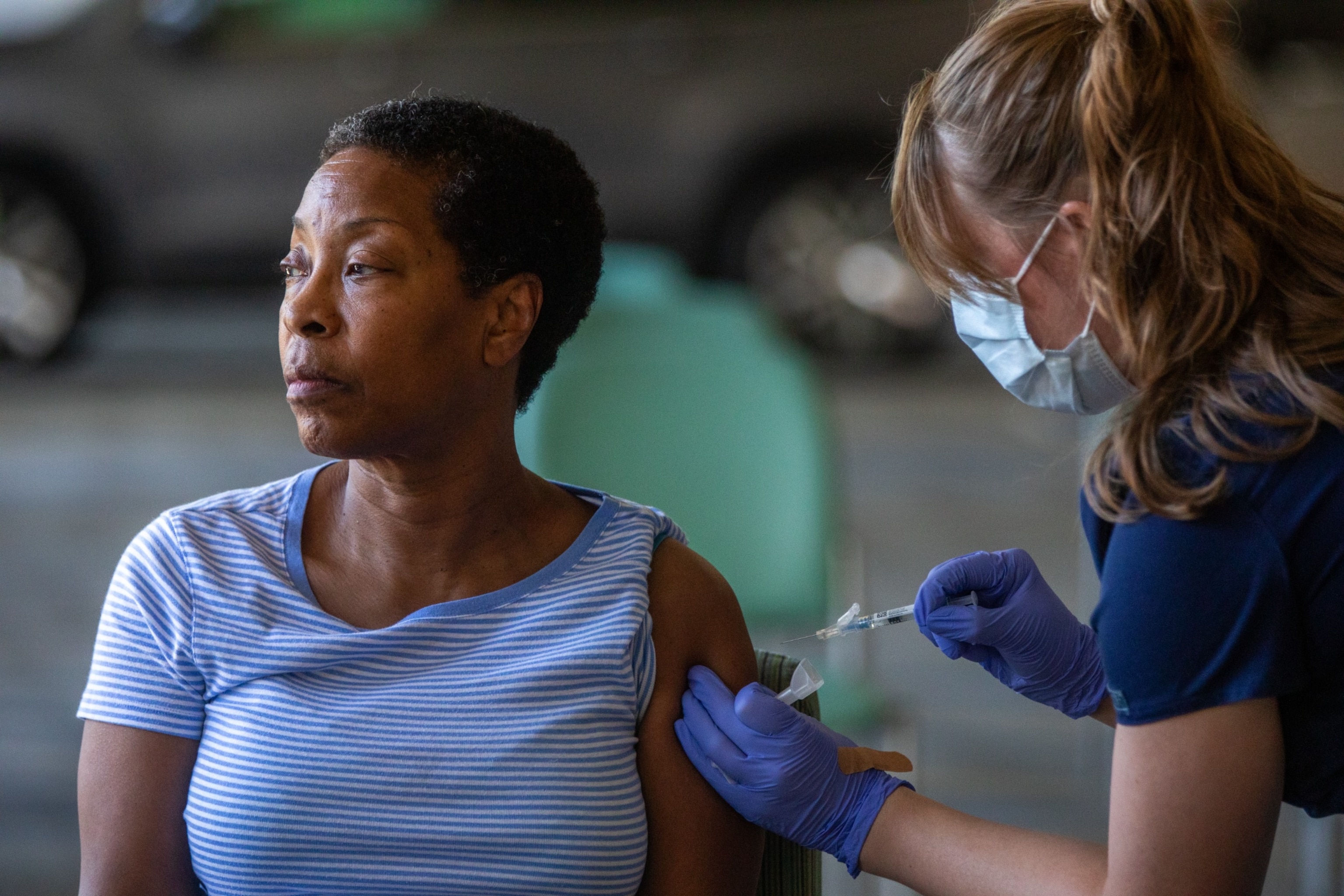 PHOTO: Denise Fractious, 68, of Pasadena, receives her COVID vaccine during a flu and COVID-19 vaccination clinic at Kaiser Permanente Pasadena on Oct. 12, 2023, in Pasadena, Calif.