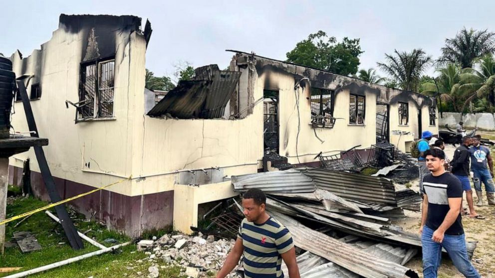 Guyana prosecutors consider charging teenage suspect in fatal fire at girls' dormitory.