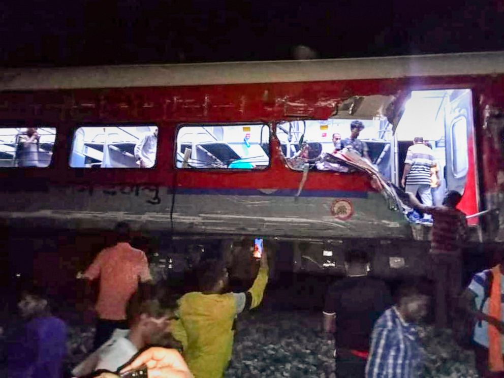 At least 50 killed and several trapped as passenger train derails in India