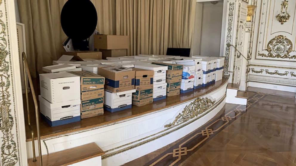 Boxes of documents, including those stored in a bathroom, seen in Trump indictment photos at Mar-a-Lago.
