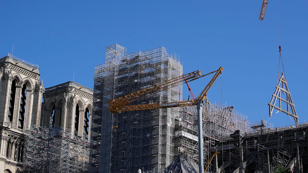 Crane Assists in Raising Large Wood Trusses to Notre Dame's Fire-Damaged Roof in Paris