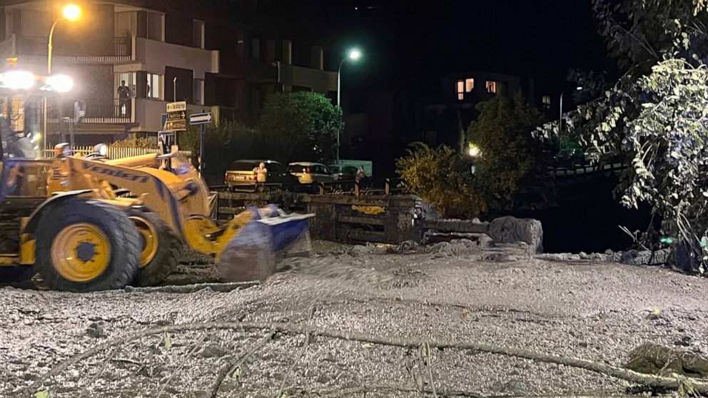 Search and Rescue Efforts Underway for Possible Missing Individuals Following Mudslide in the Italian Alps Resulting in City Streets Covered in Muck
