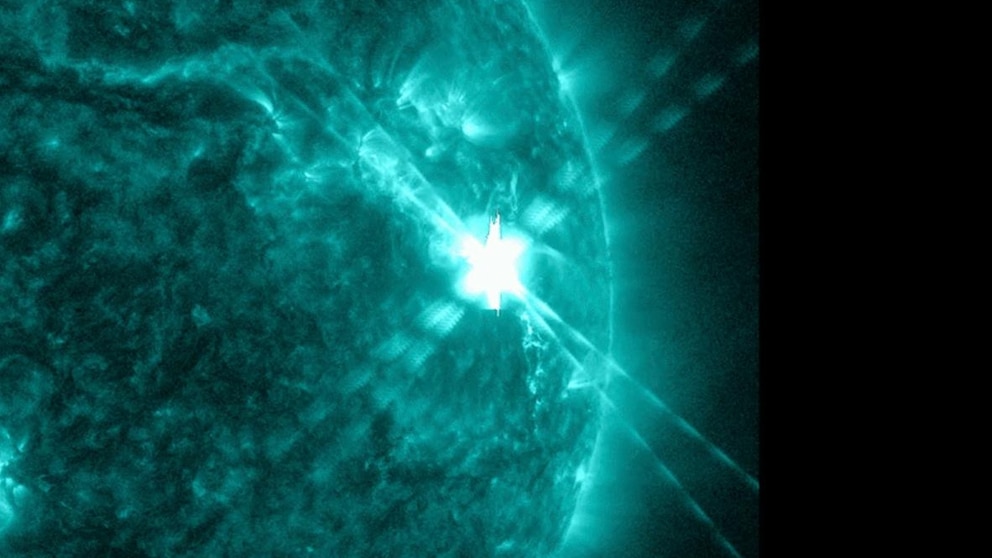 Temporary disruption of radio signals on Earth caused by the largest solar flare in years