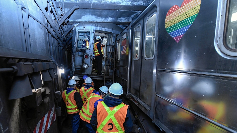 More than 20 people injured as subway train derails in collision with another train