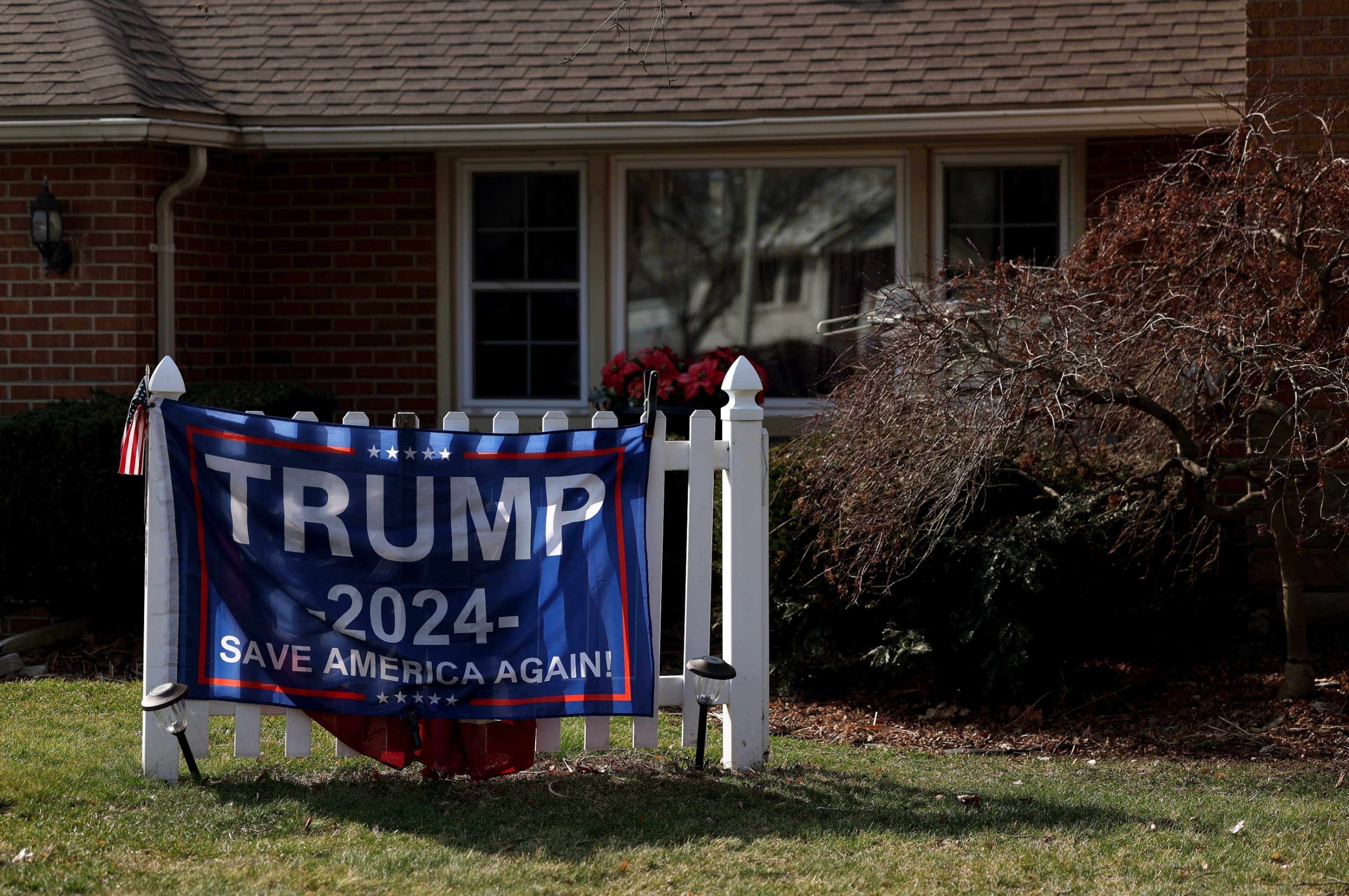 PHOTO: A sign for Republican presidential candidate former President Donald Trump is displayed in a yard on primary election day on Feb. 27, 2024 in Dearborn, Mich.