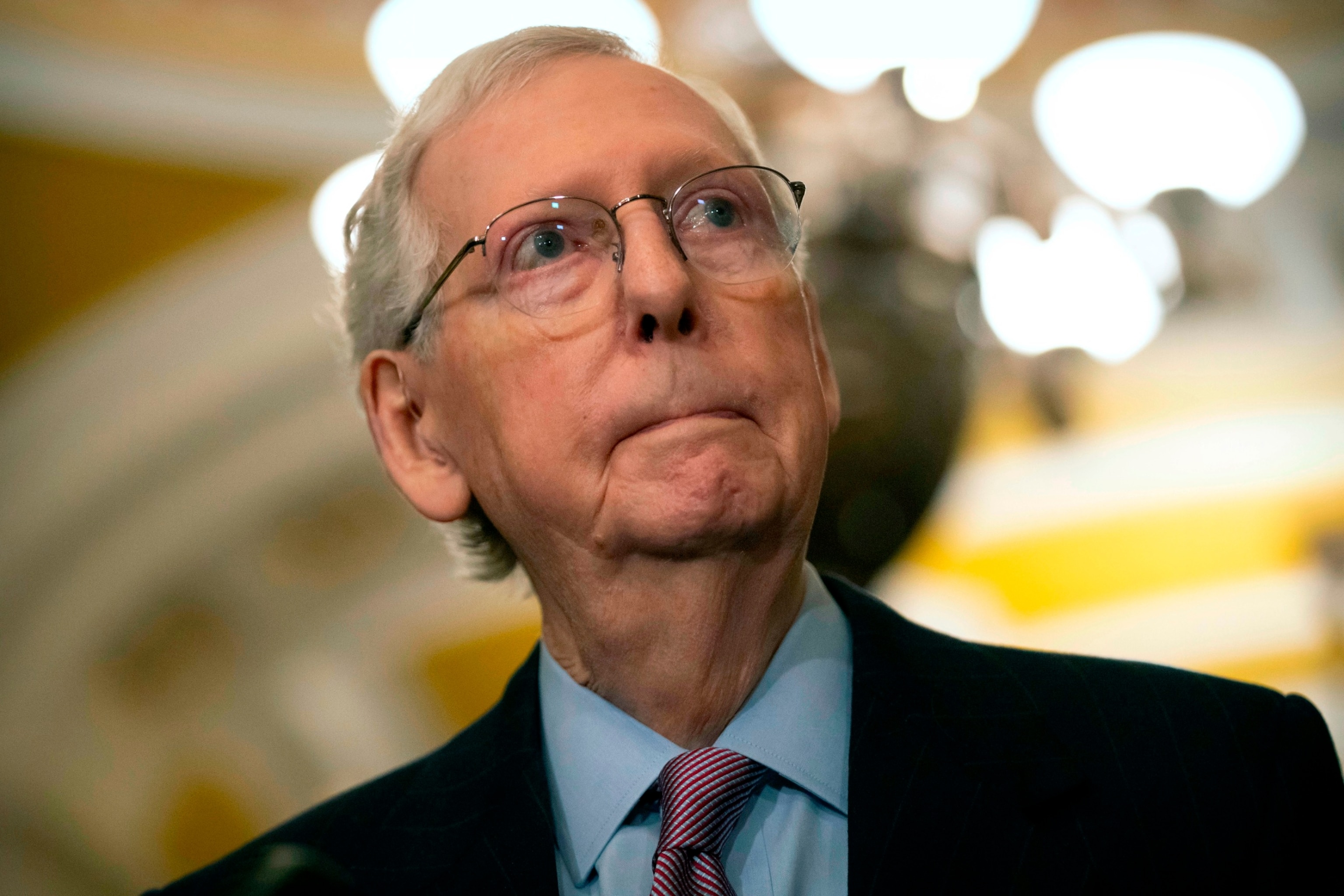 PHOTO: Senate Minority Leader Mitch McConnell of Ky., listens to a reporter's question during a press availability on Capitol Hill, Feb. 27, 2024, in Washington.