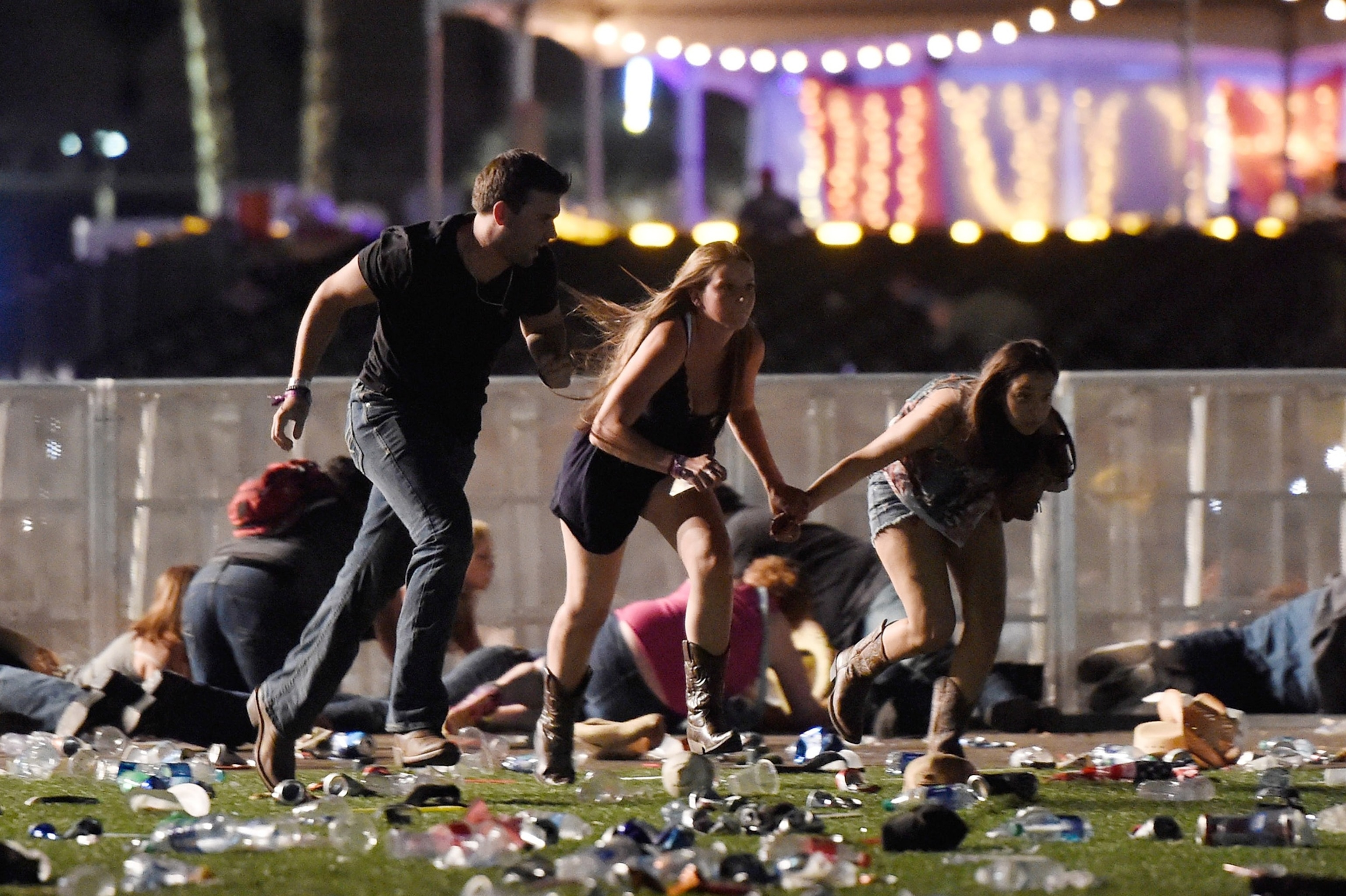 PHOTO: In this Oct. 1, 2017, file photo, people run from the Route 91 Harvest country music festival after apparent gun fire was heard, in Las Vegas.