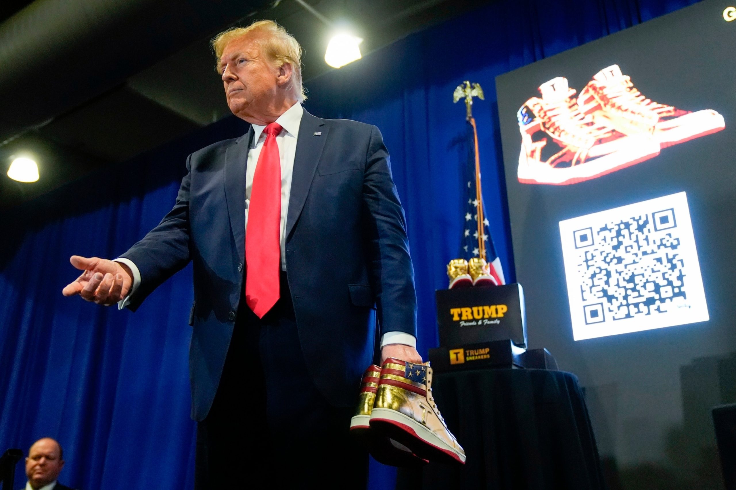 Trump faces backlash from crowd while promoting sneakers in Philadelphia