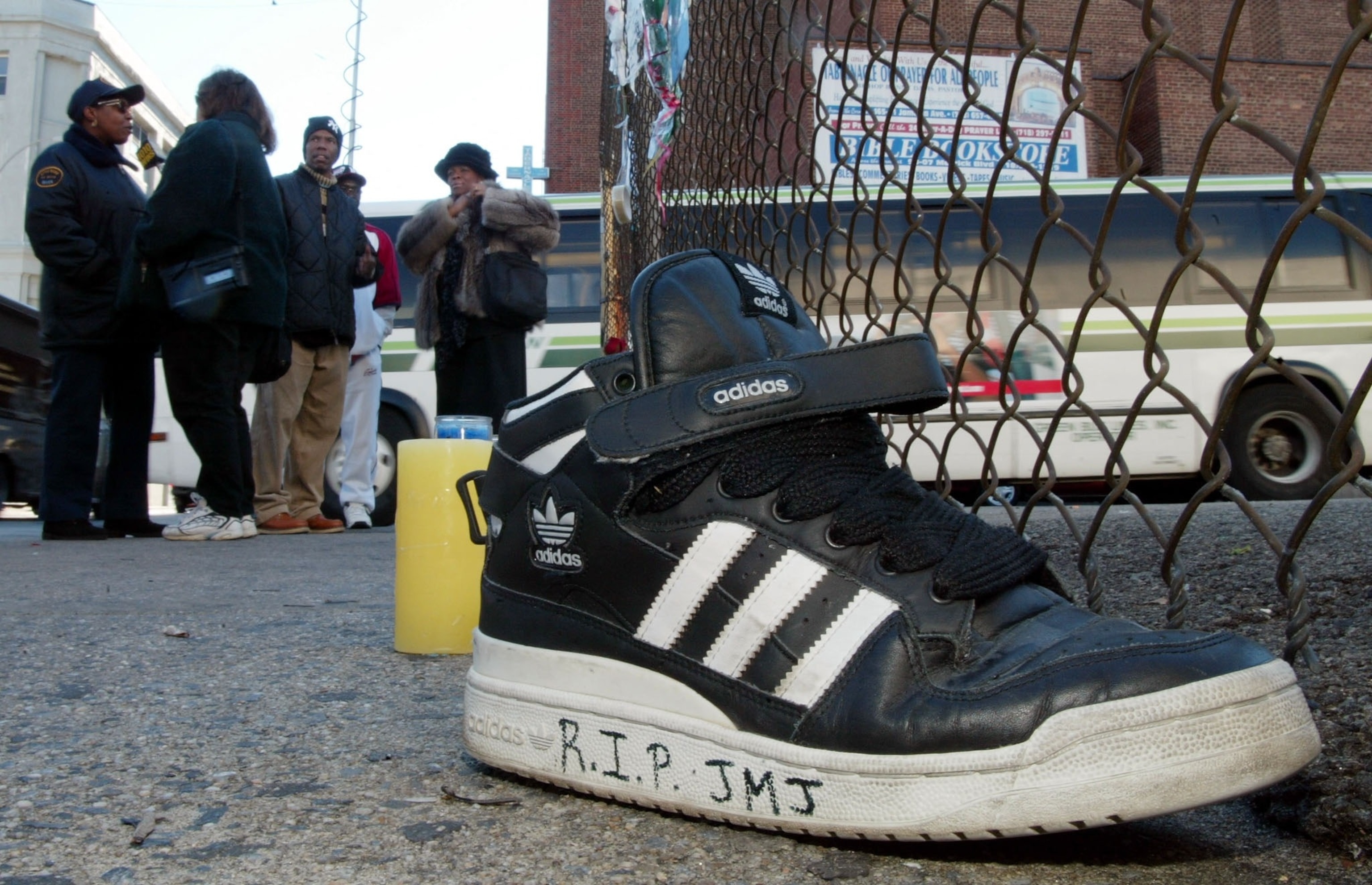 PHOTO: An Adidas sneaker bearing a message sits on the street outside a music studio in Queens, New York, on Oct.31, 2002, where former Run-DMC member Jason Mizell, who was also known as DJ Jam Master Jay, was shot and killed Oct. 30.