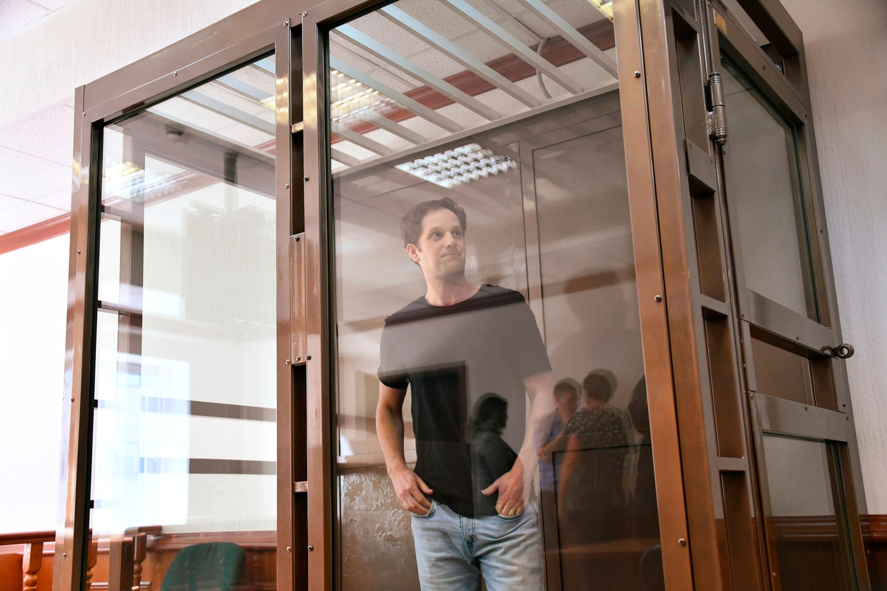 PHOTO: Wall Street Journal reporter Evan Gershkovich stands in a glass cage in a courtroom at the Moscow City Court, in Moscow, Russia, June 22, 2023. 