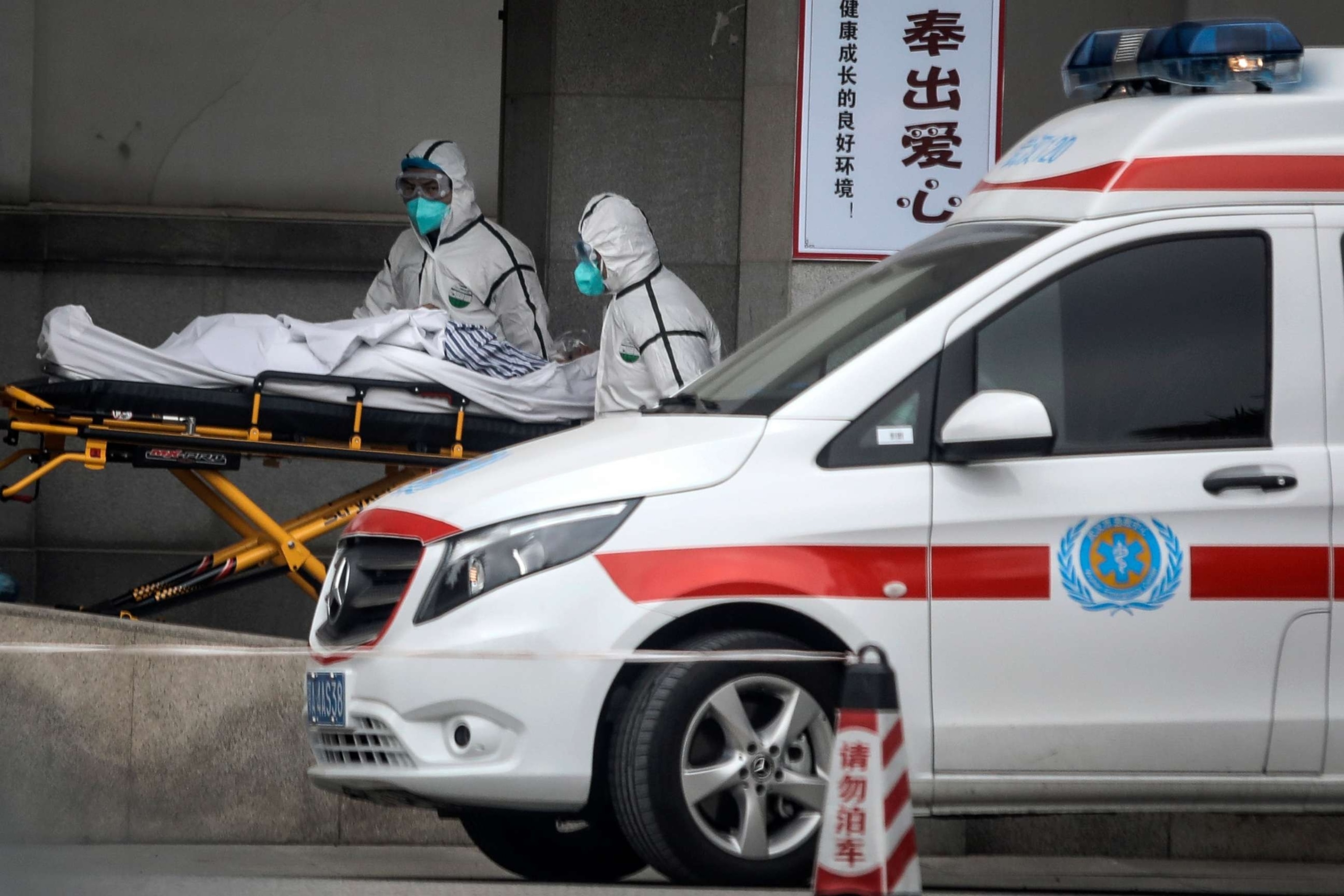 PHOTO: In this Jan. 17, 2020, file photo, medical staff transfer patients to Jin Yintan hospital in Wuhan, Hubei, China, after a second person in the city had died of a pneumonia-like virus since the outbreak started in December.