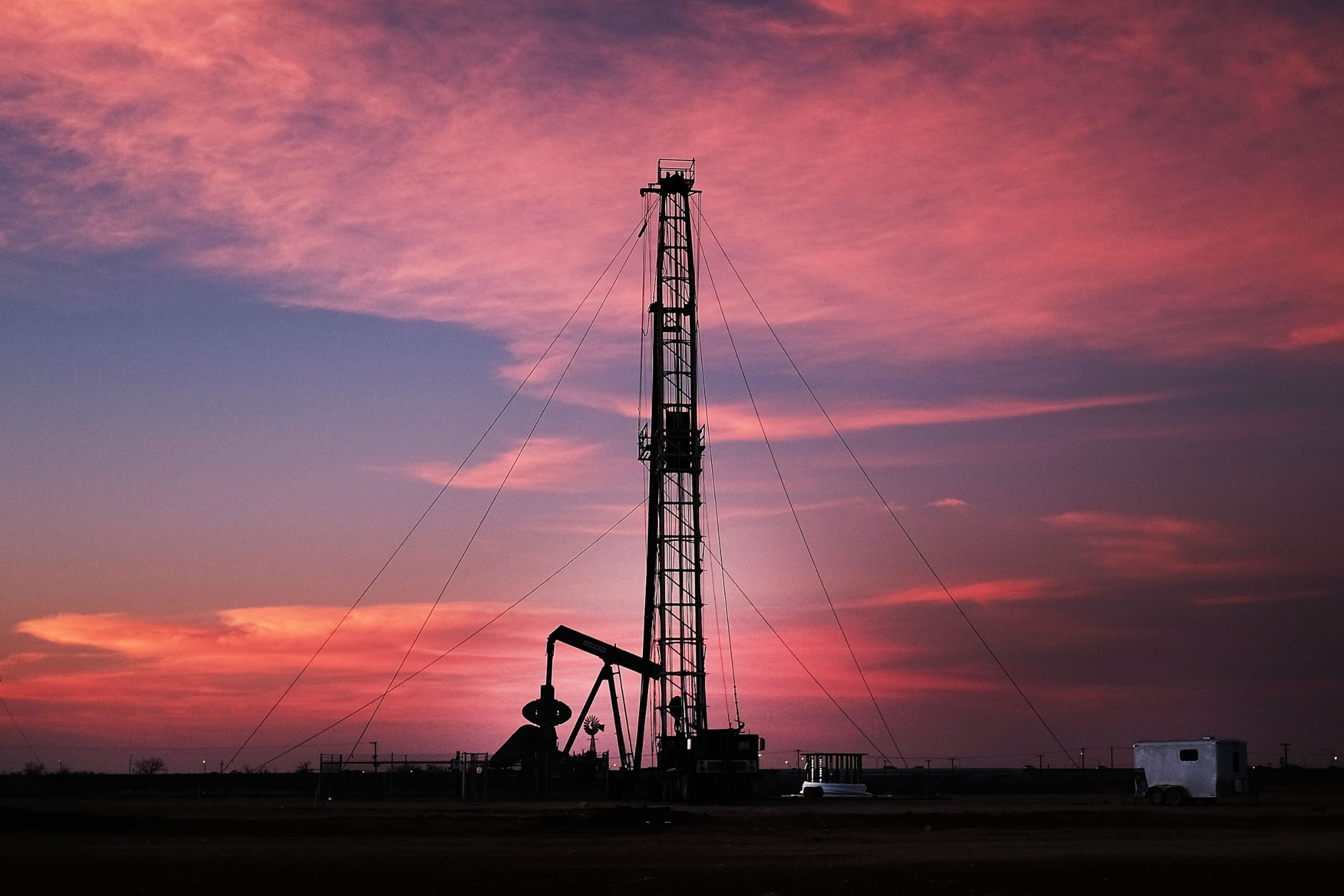 PHOTO: An oil drill is viewed near a construction site for homes and office buildings in Midland, TX, Feb. 5, 2015. 