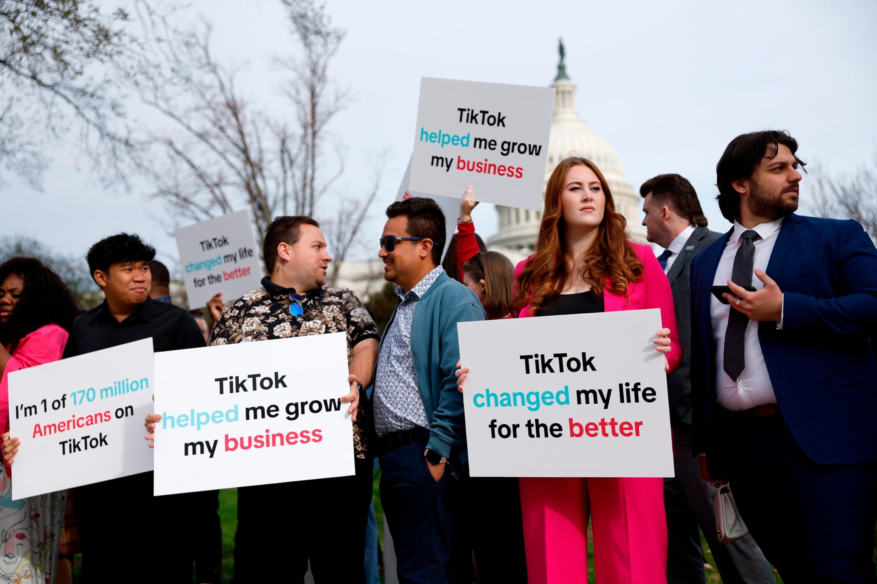 PHOTO: Participants hold signs in support of TikTok outside the U.S. Capitol Building on March 13, 2024 in Washington, DC. 