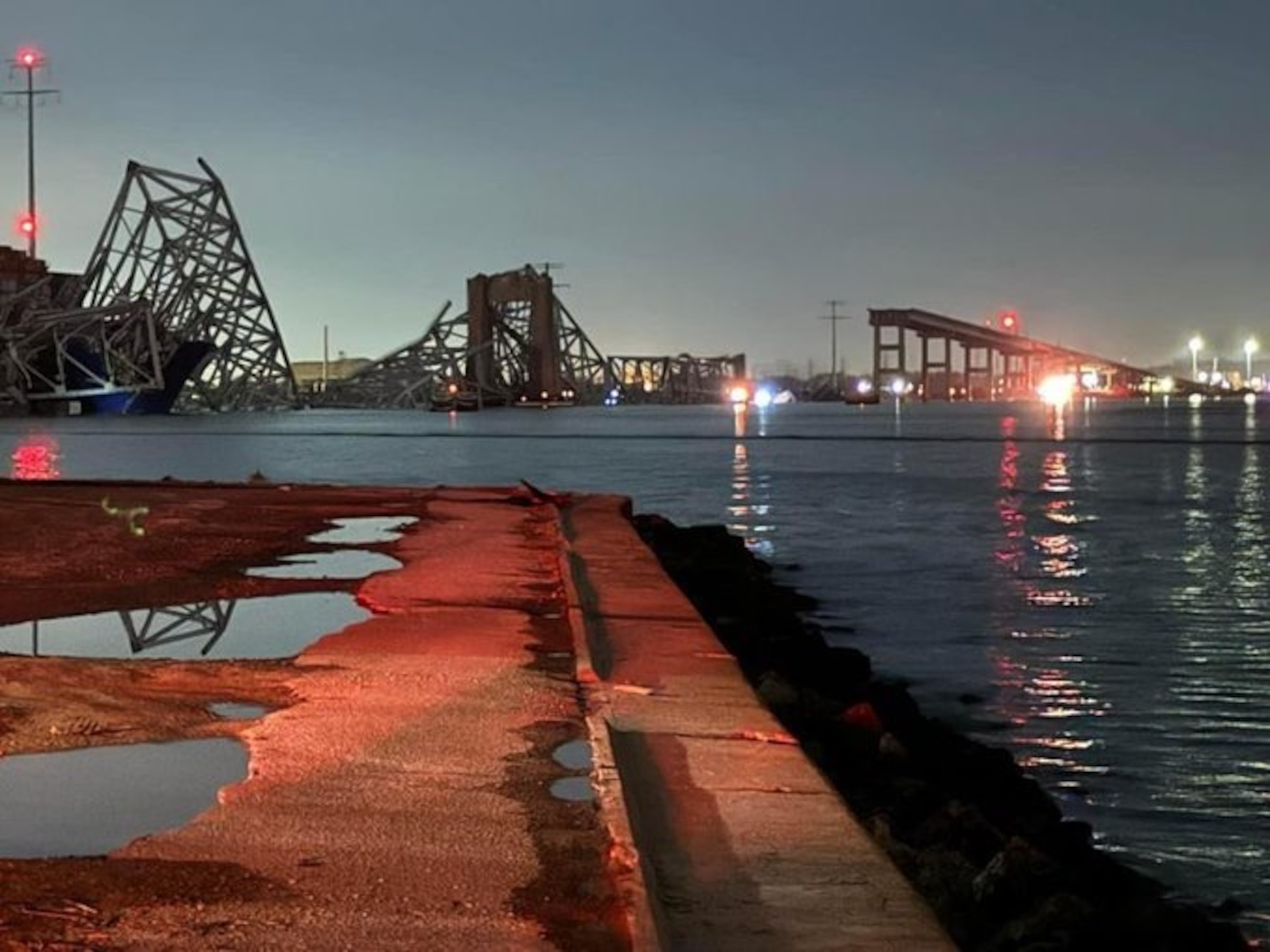 PHOTO: A view of the partially collapsed Francis Scott Key Bridge in Baltimore, Maryland, on March 26, 2024, in a photo supplied by Andrew Doyle.
