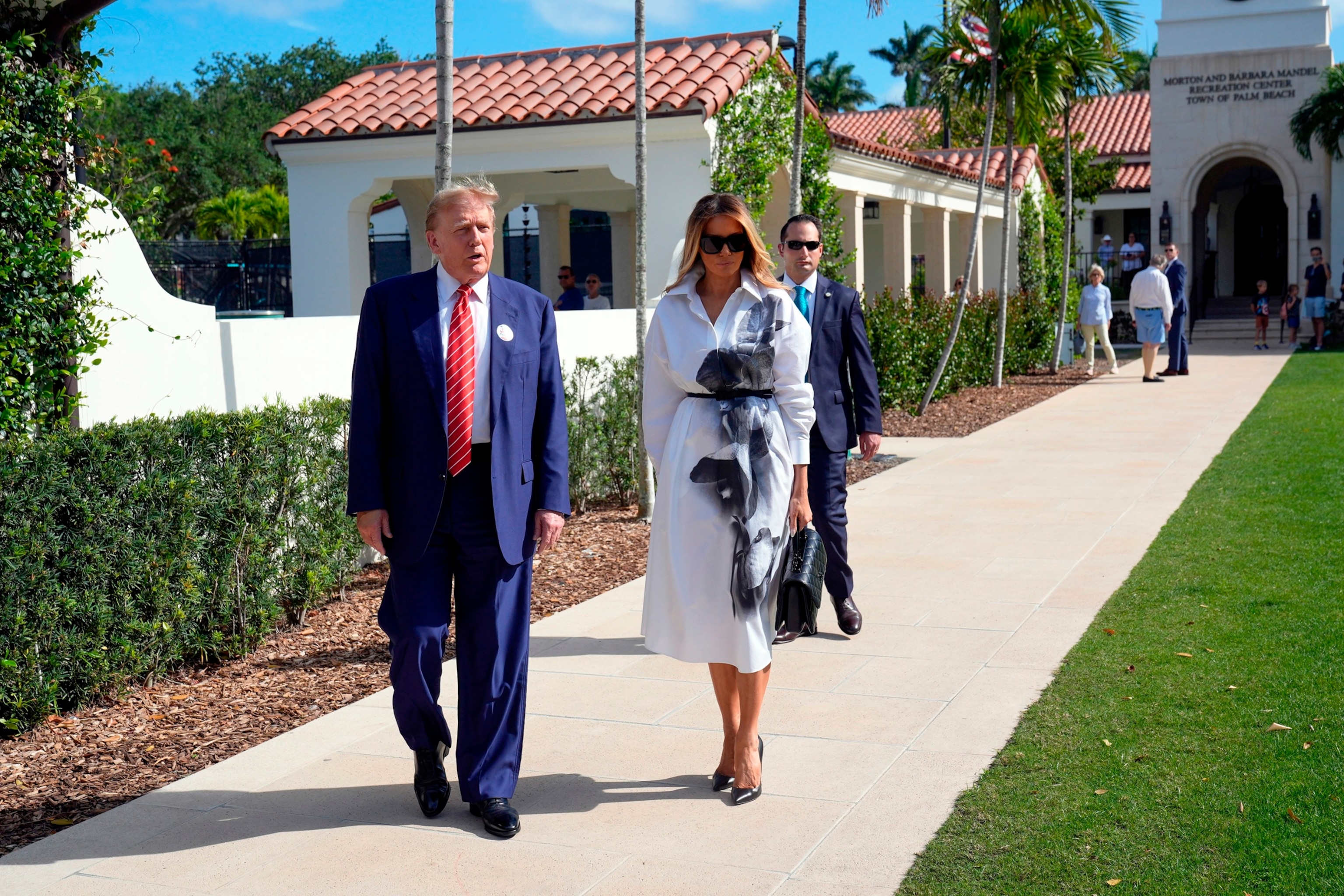 PHOTO: Republican presidential candidate former President Donald Trump and former first lady Melania Trump leave after voting in the Florida primary election in Palm Beach, Fla., on March 19, 2024. 