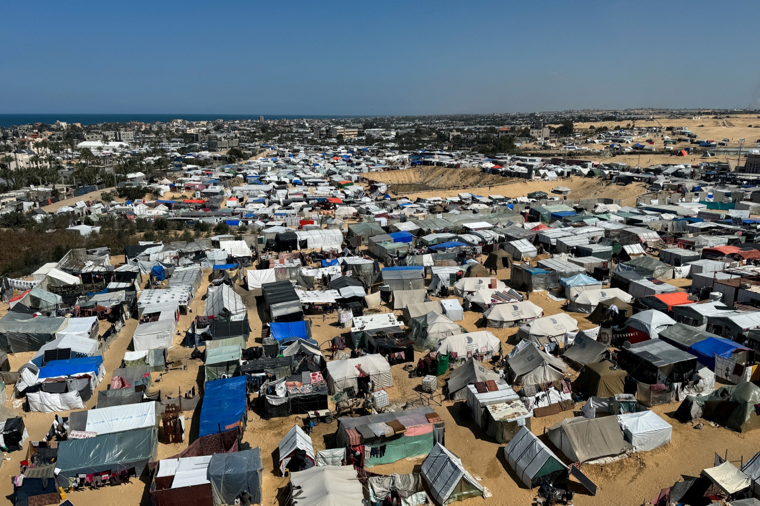PHOTO: Displaced Palestinians, who fled their houses due to Israeli strikes, shelter in a tent camp, amid the ongoing conflict between Israel and the Palestinian Islamist group Hamas, in Rafah, in the southern Gaza Strip Mar. 11, 2024.