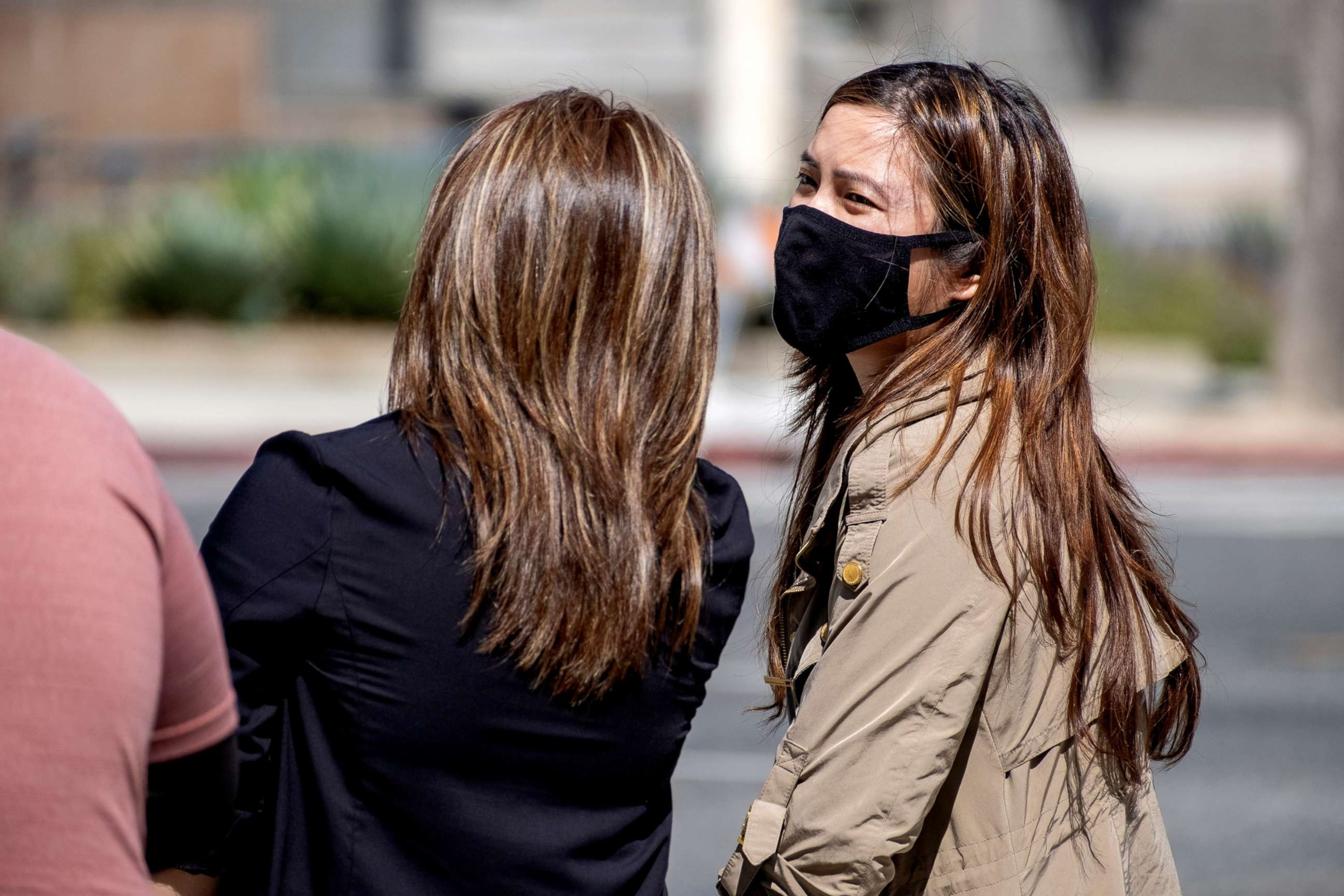 PHOTO: Pedestrians wear masks in Los Angeles July 13, 2022.