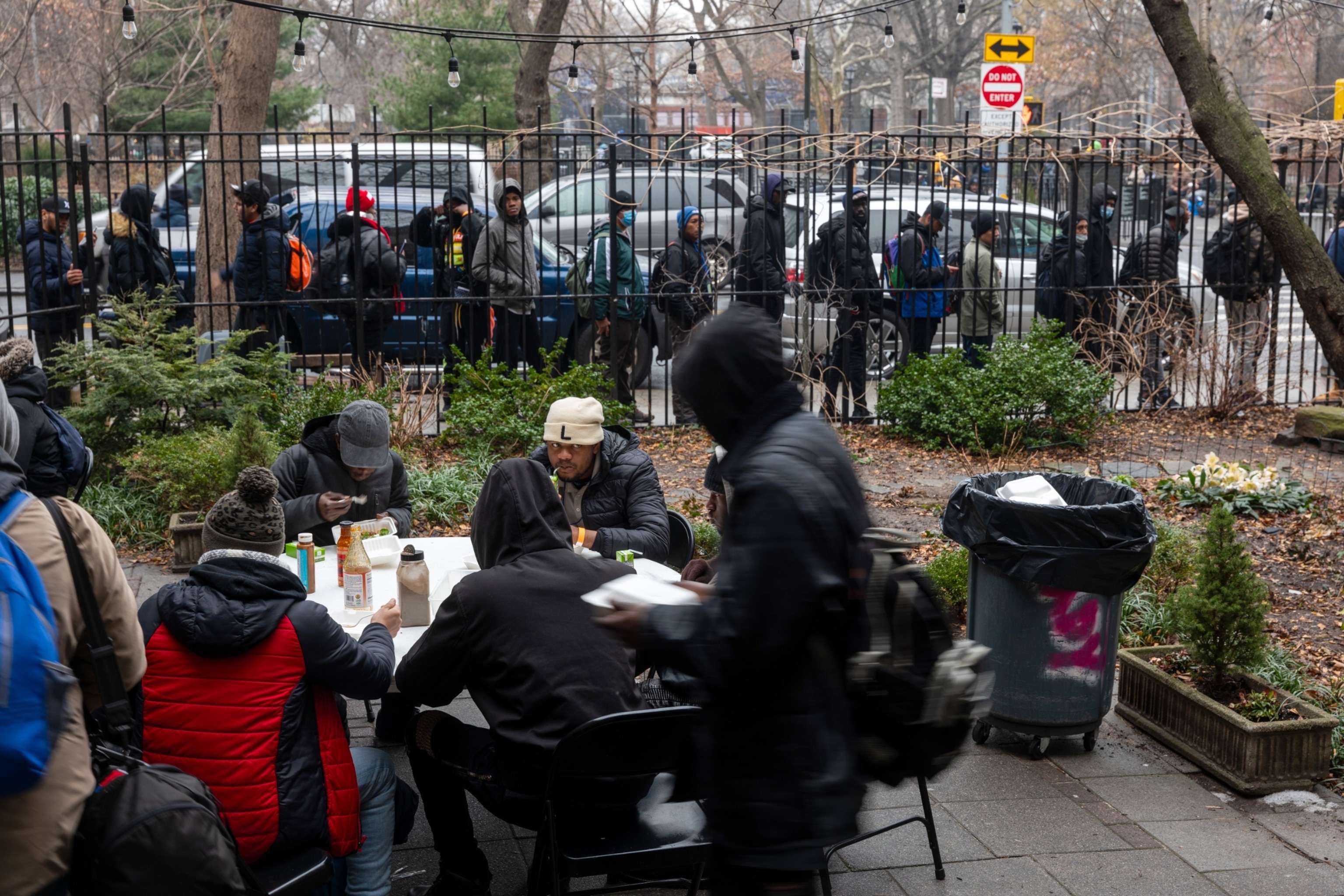 PHOTO: Newly arrived migrants receive an afternoon meal from Trinity Services and Food For the Homeless, across from Tompkins Square Park on January 24, 2024 in New York City.
