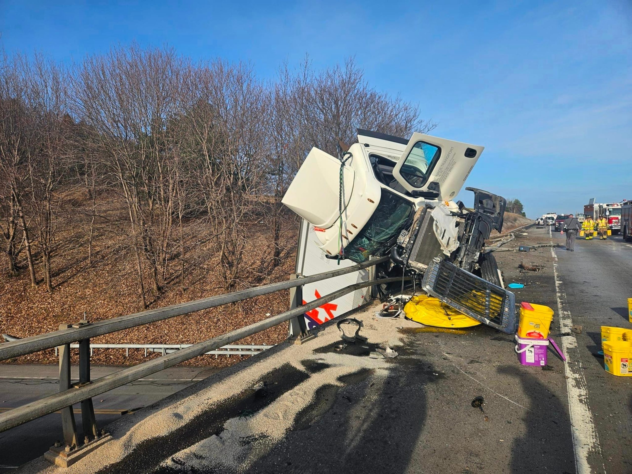 Officials report that 5 individuals, including an infant, sustain injuries following FedEx semitrailer rollover on New York bridge.