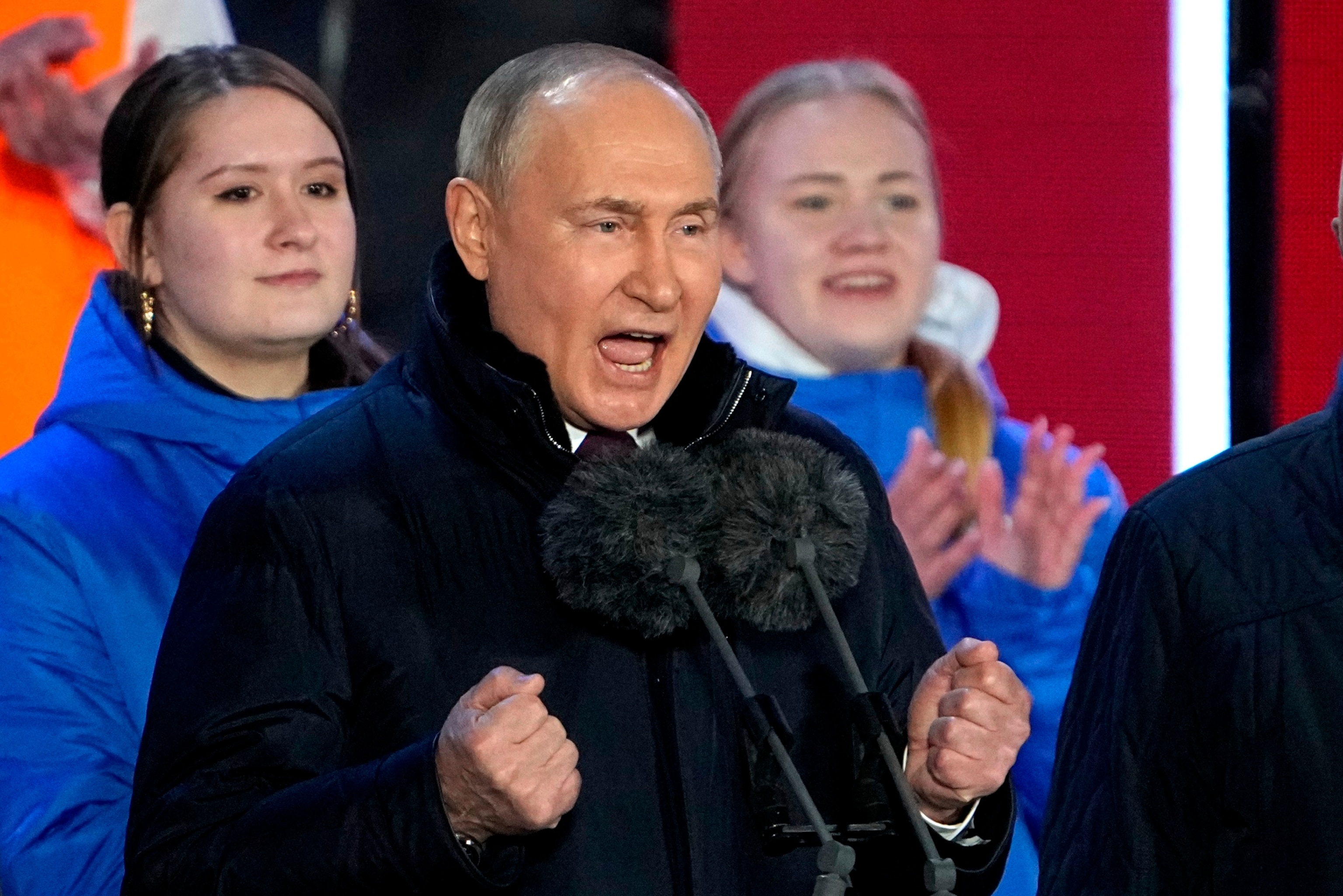 PHOTO: Russian President Vladimir Putin speaks at a concert marking his victory in a presidential election and the 10-year anniversary of Crimea's annexation by Russia on Red Square in Moscow, March 18, 2024. 