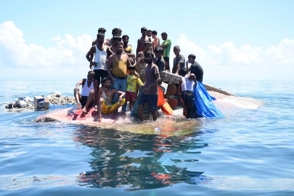 Rohingya refugees rescued from capsized boat after being found weeping, weak, and soaked