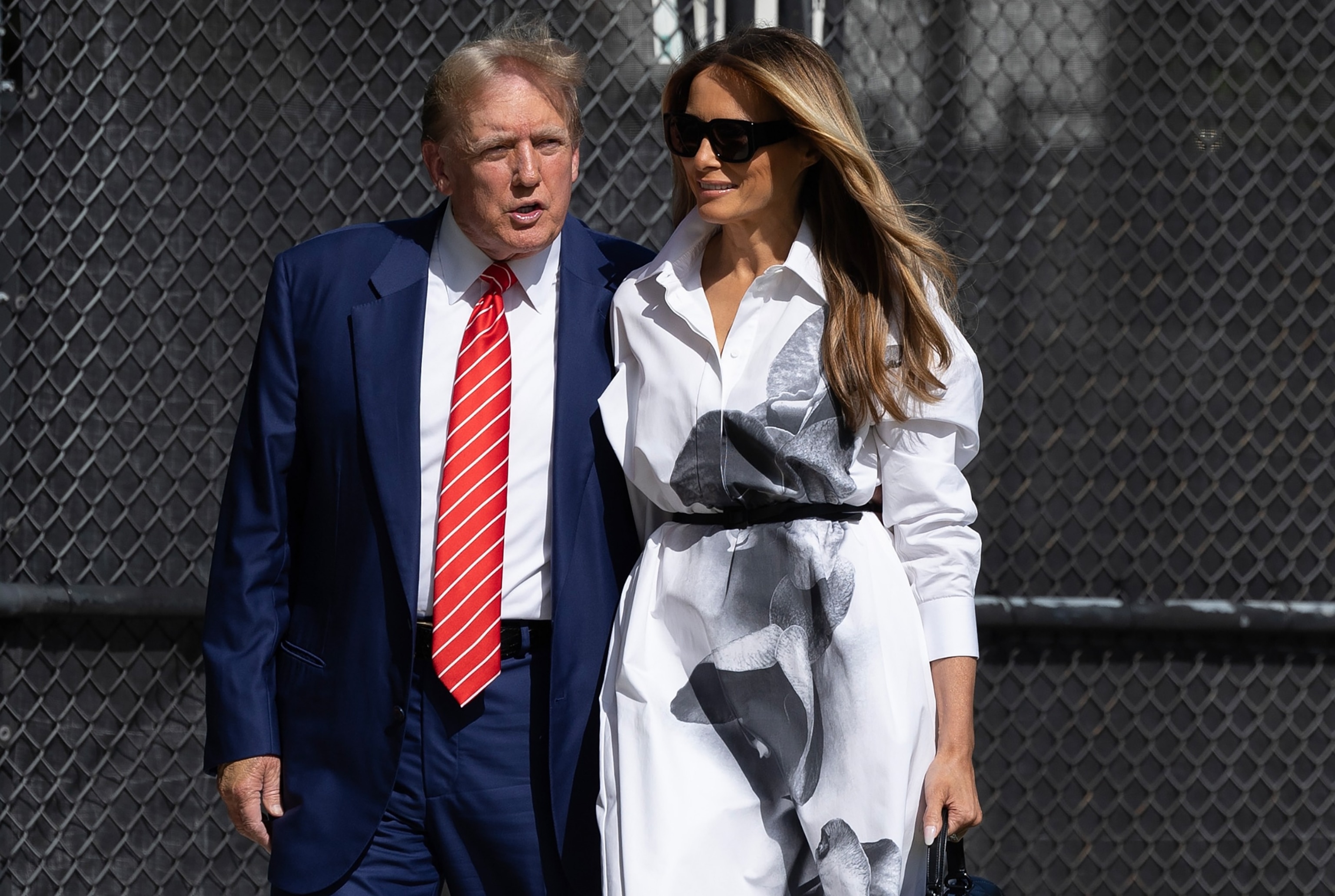 PHOTO: Former U.S. President Donald Trump and former first lady Melania Trump walk together as they prepare to vote at a polling station setup in the Morton and Barbara Mandel Recreation Center, Mar. 19, 2024, in Palm Beach, Fla.  