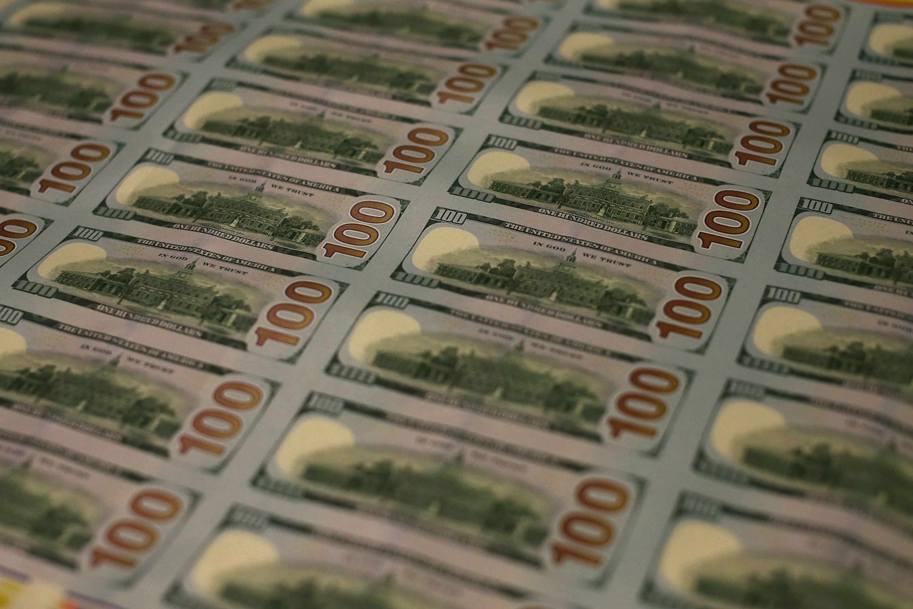 PHOTO: Redesigned $100 notes lay in stacks at the Bureau of Engraving and Printing on May 20, 2013 in Washington, DC. 