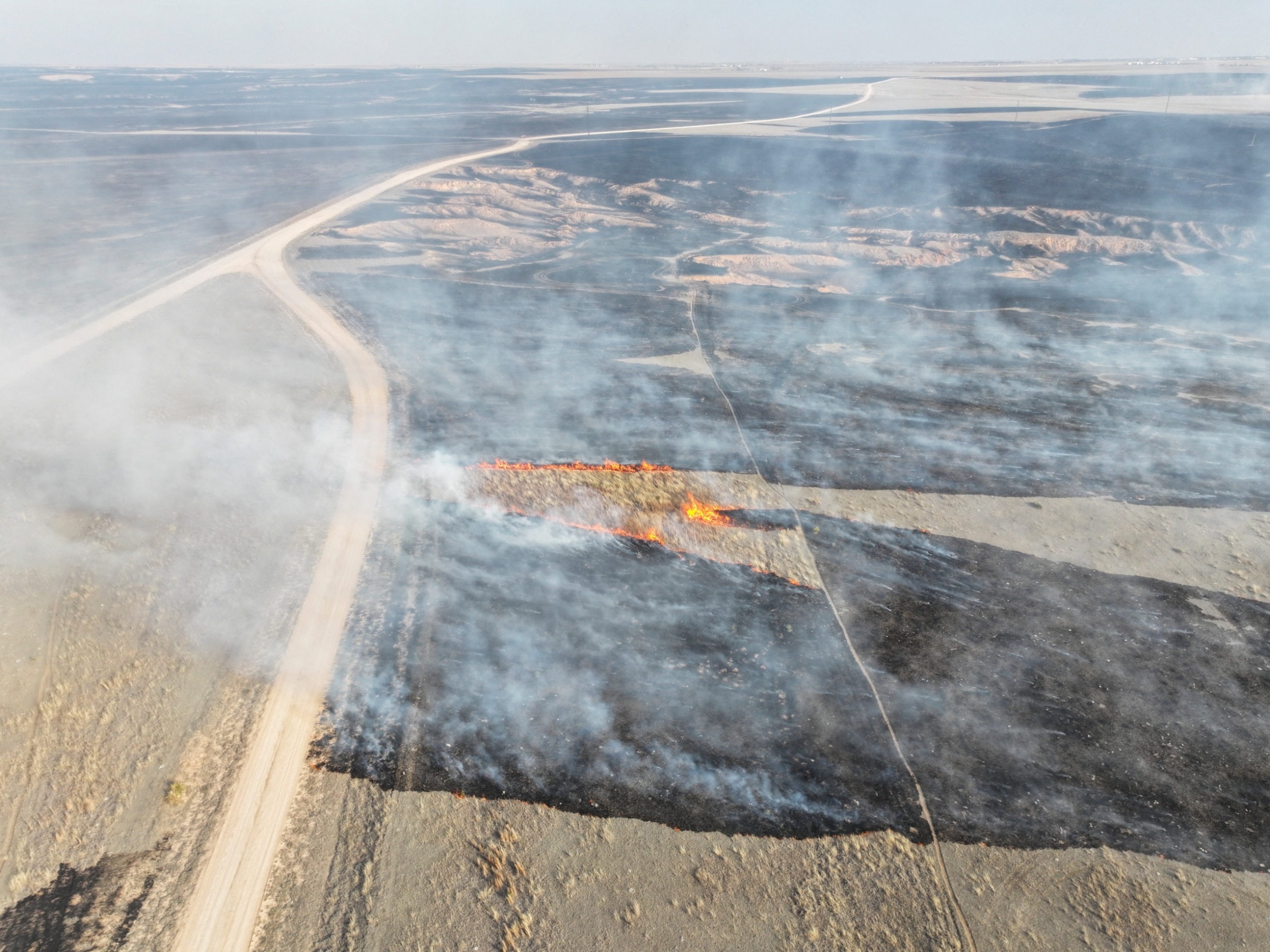 PHOTO: A drone view of the grasslands burning from the Smokehouse Creek Fire in Roberts County, Texas, on Feb. 28, 2024.