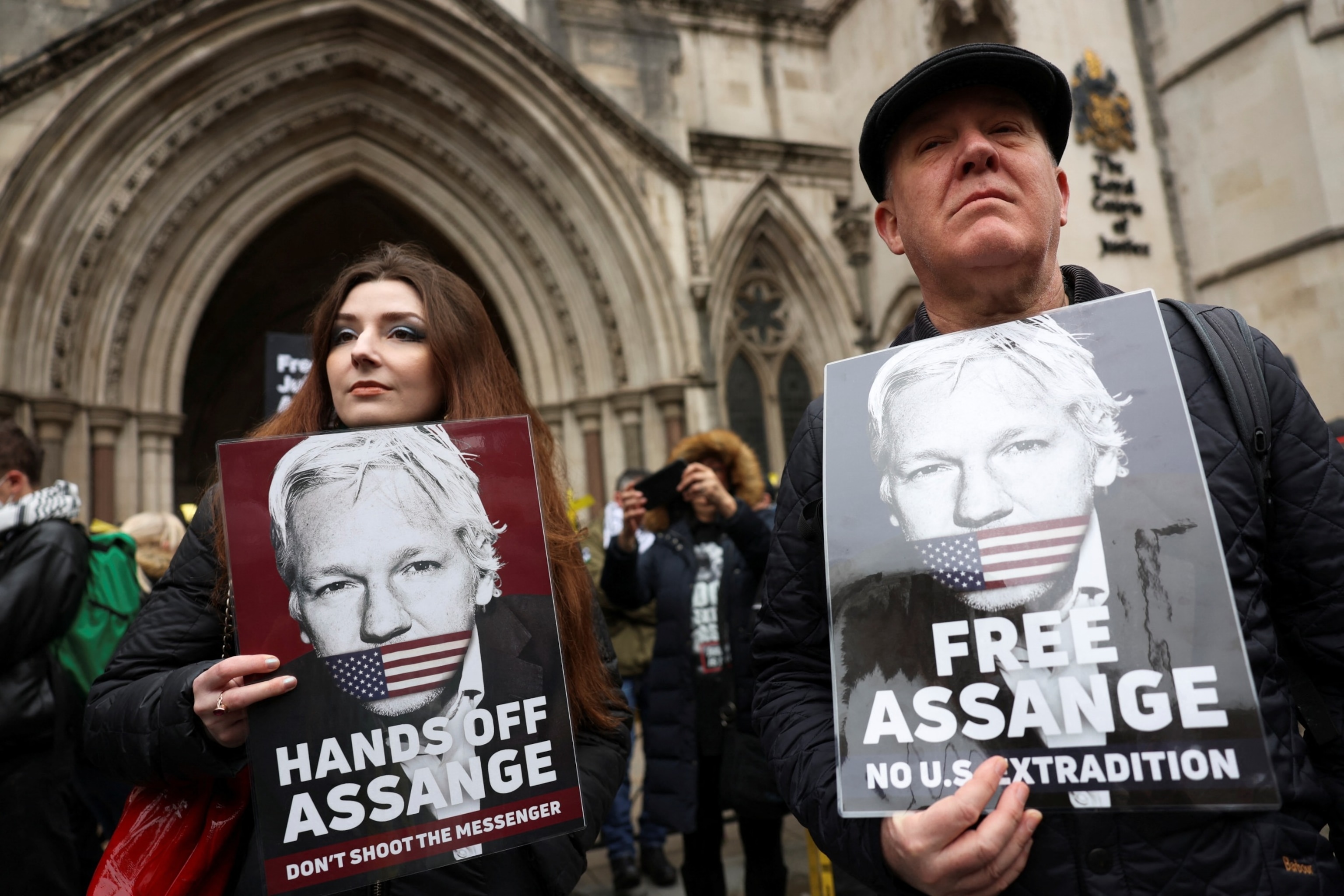PHOTO: Supporters of WikiLeaks founder Julian Assange stand outside the high court on the day Assange appeals against his extradition to the United States, in London, Feb. 20, 2024. 