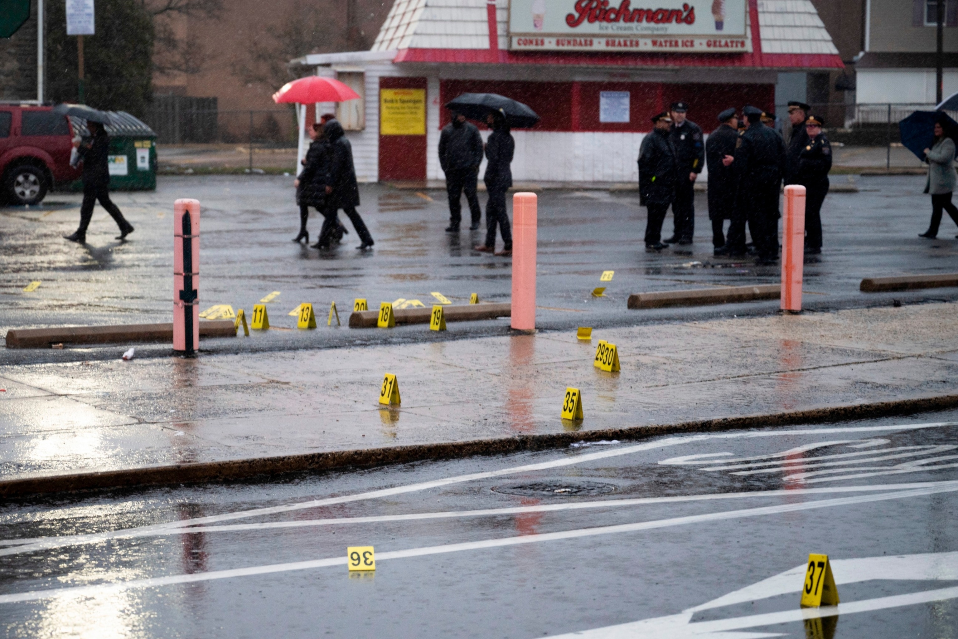 PHOTO: Evidence markers are seen following a shooting in Northeast Philadelphia, March 6, 2024.