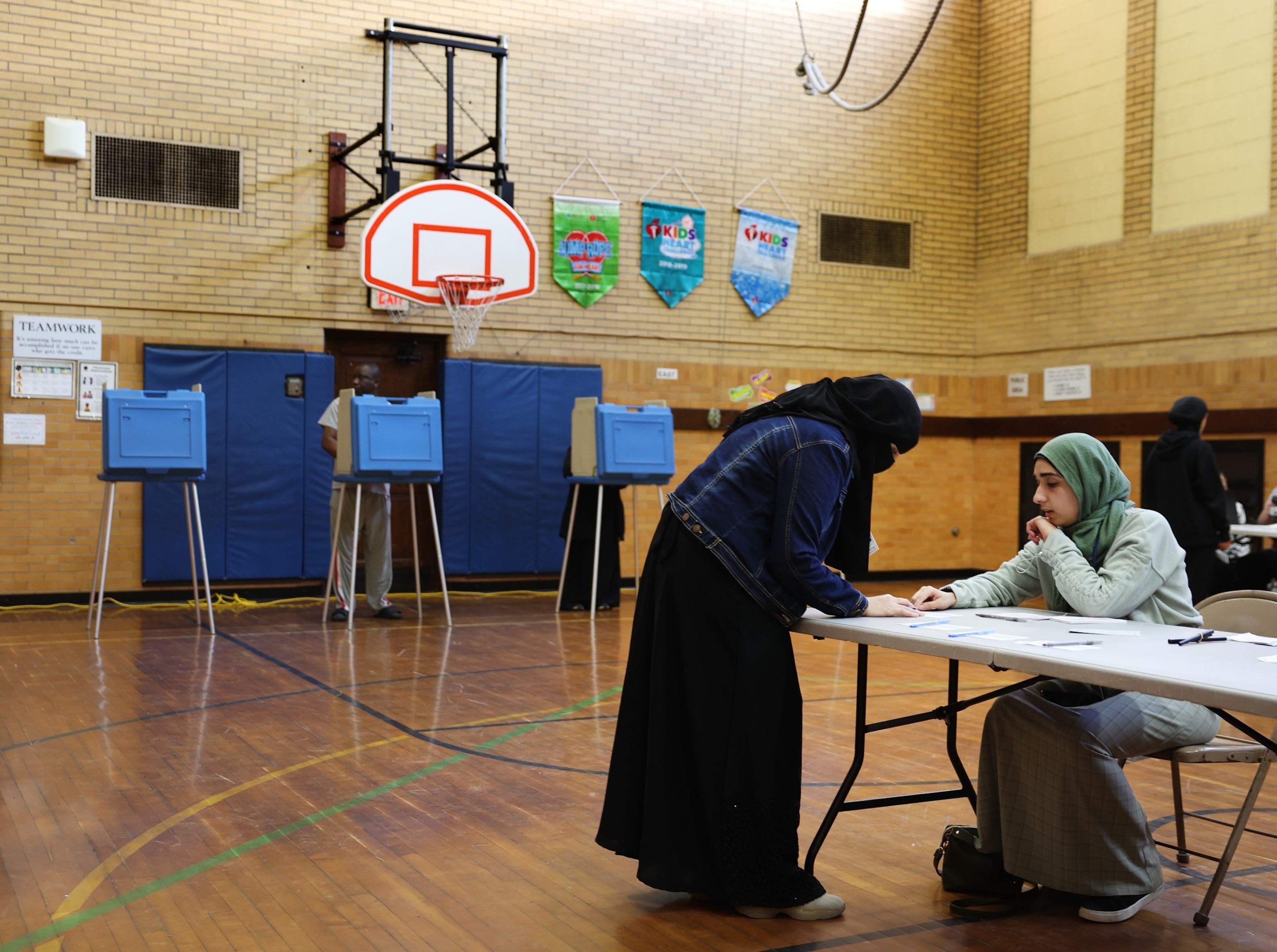 PHOTO: A voter checks-in to cast their ballot in the Michigan primary election at McDonald Elementary School, Feb. 27, 2024, in Dearborn, Mich.