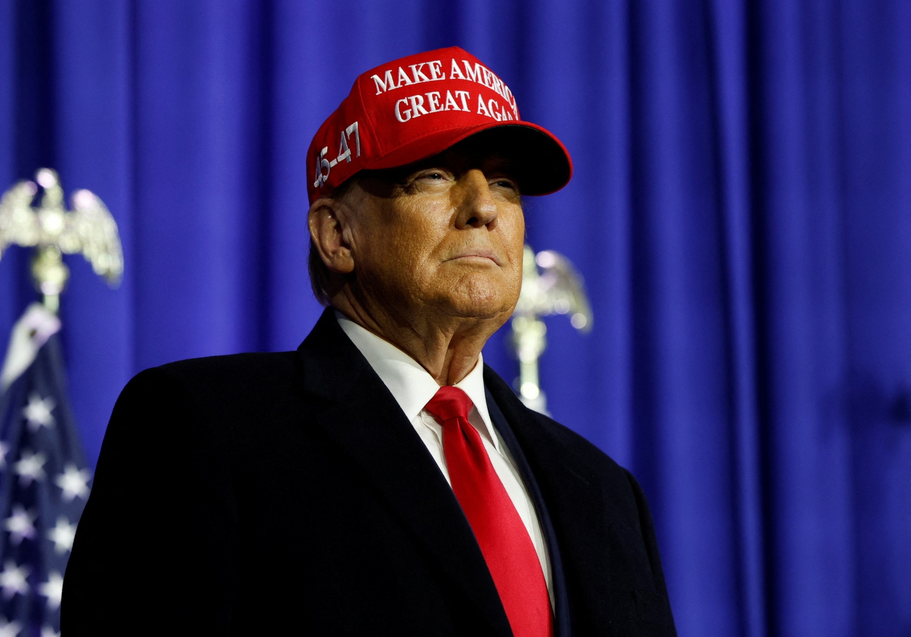 PHOTO: Former U.S. President Donald Trump looks on at a campaign event in Waterford Township, Michigan