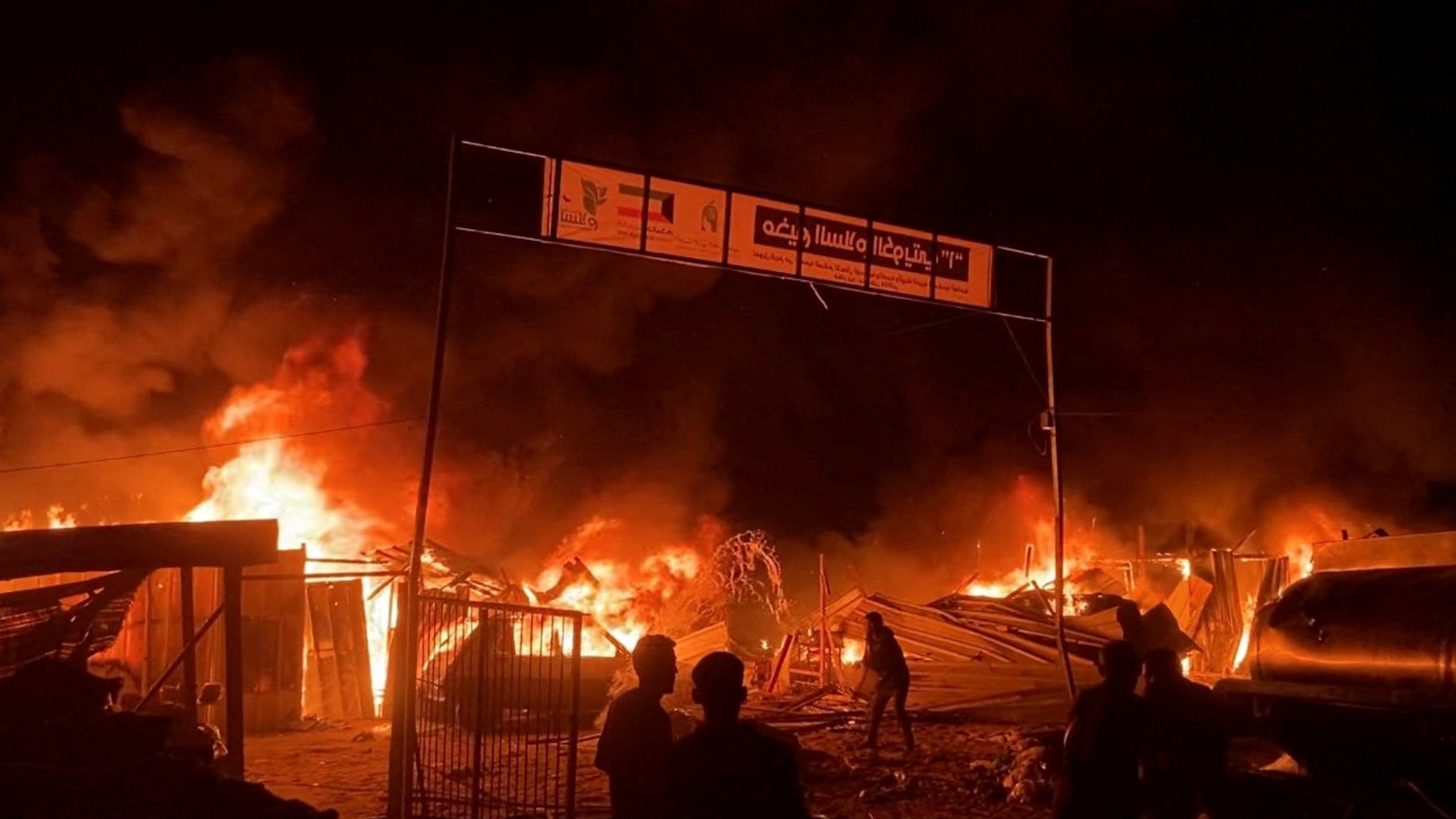 PHOTO: Fire rages following an Israeli strike on an area designated for displaced Palestinians, amid the ongoing conflict between Israel and Hamas, in Rafah in the southern Gaza Strip, May 26, 2024. 