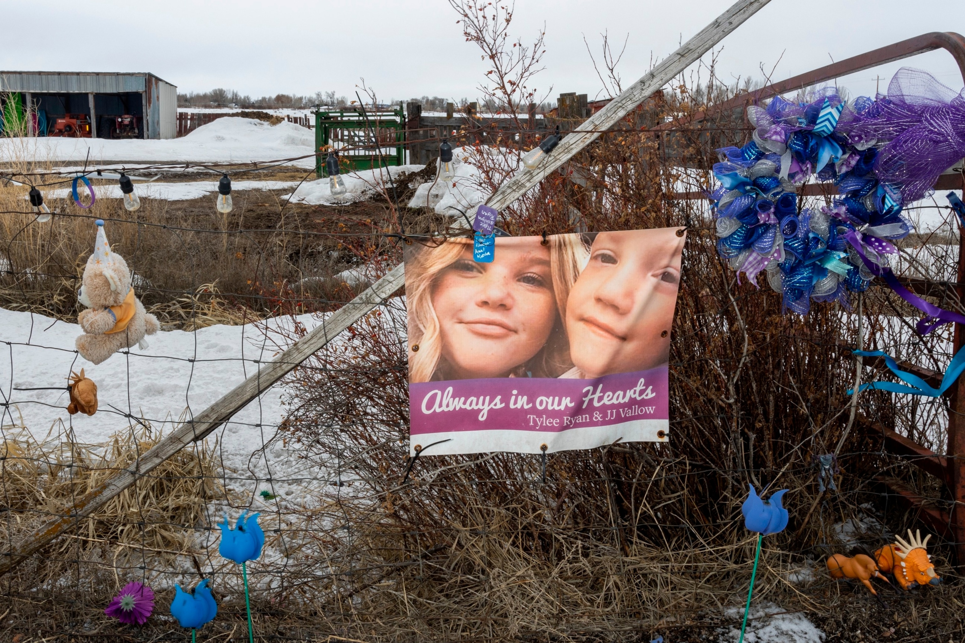 PHOTO: A picture of Tylee Ryan and J.J. Vallow is seen on a fence opposite the property where their bodies were found in 2020, on April 4, 2023 in Rexburg, Idaho. 