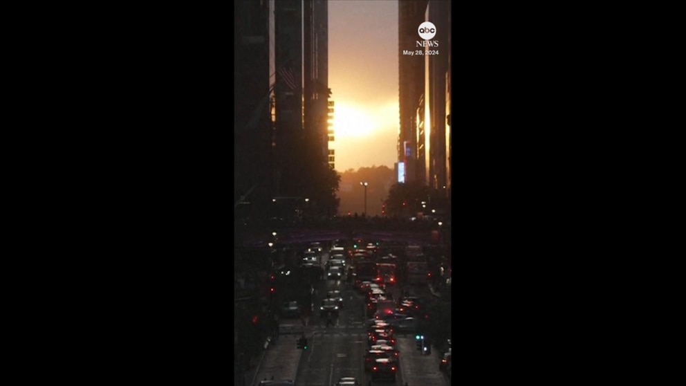 Crowds gather in New York City to witness biannual Manhattanhenge event