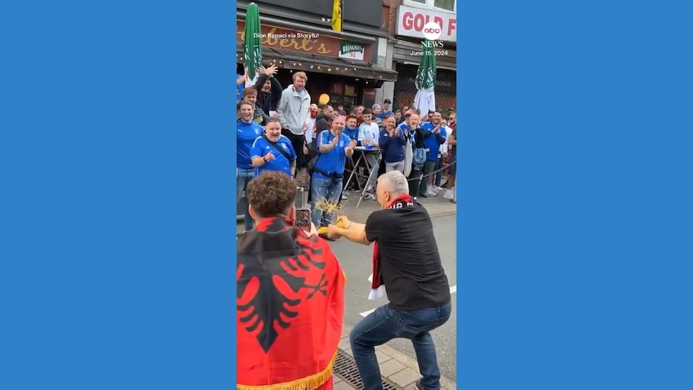 Albanian fan playfully taunts Italian supporters by snapping spaghetti in video