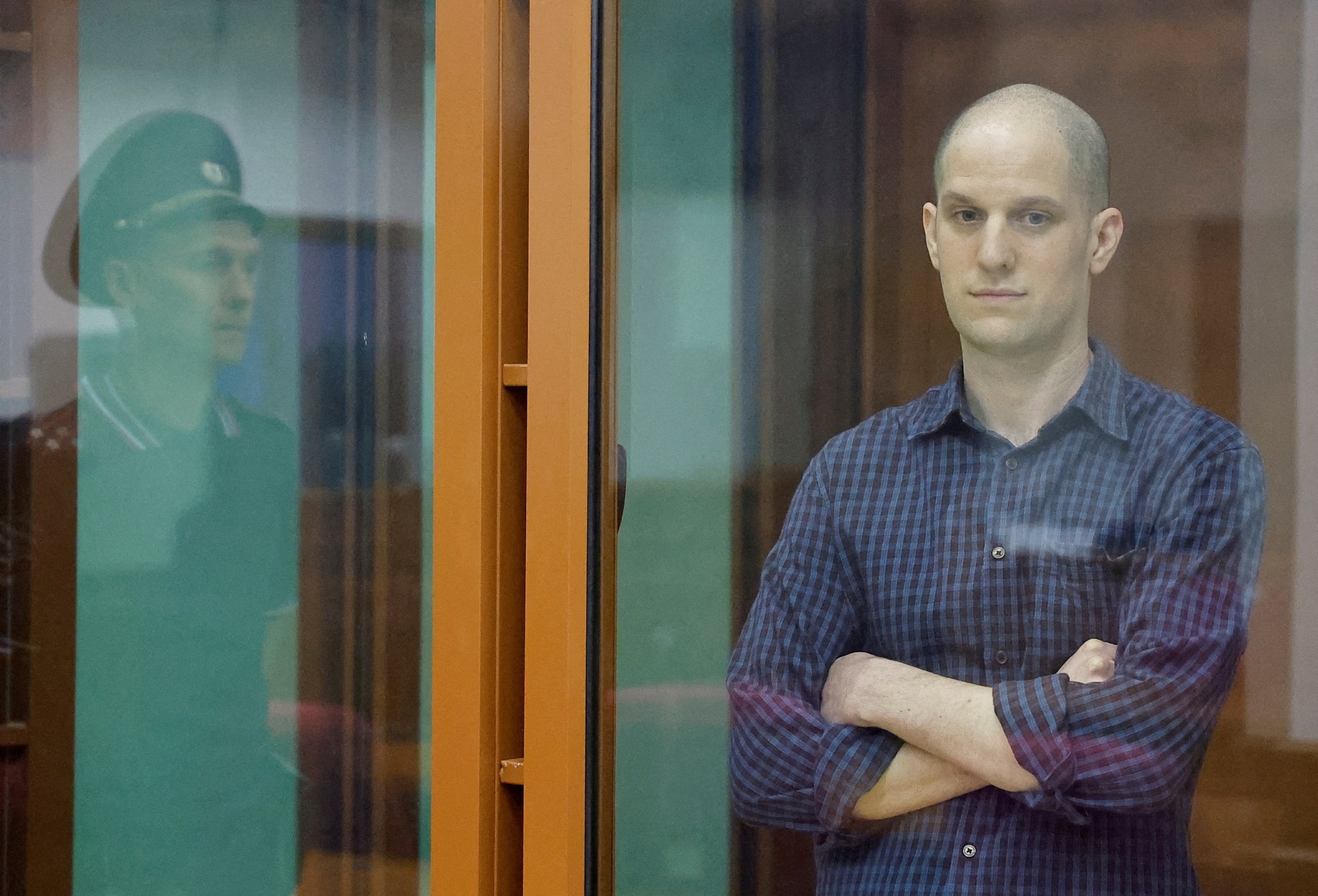 PHOTO: Wall Street Journal reporter Evan Gershkovich, who stands trial on spying charges, is seen inside an enclosure for defendants before a court hearing in Yekaterinburg, Russia June 26, 2024. 