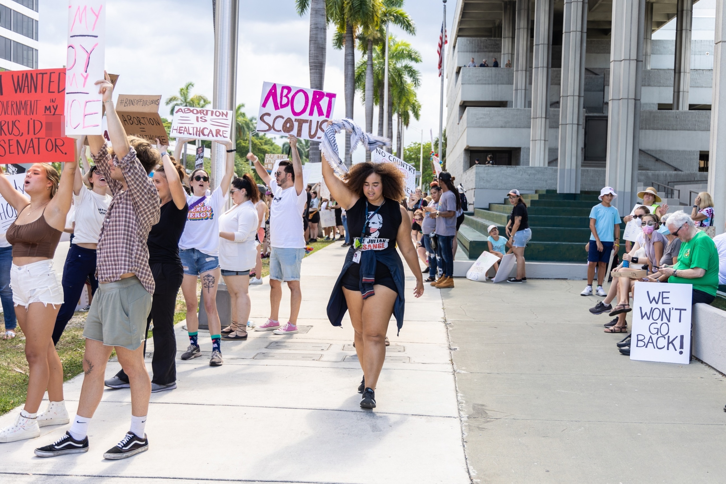 PHOTO: An abortion rights activist holds a sign at a protest in support of abortion access, July 13, 2022 in Fort Lauderdale, Florida.