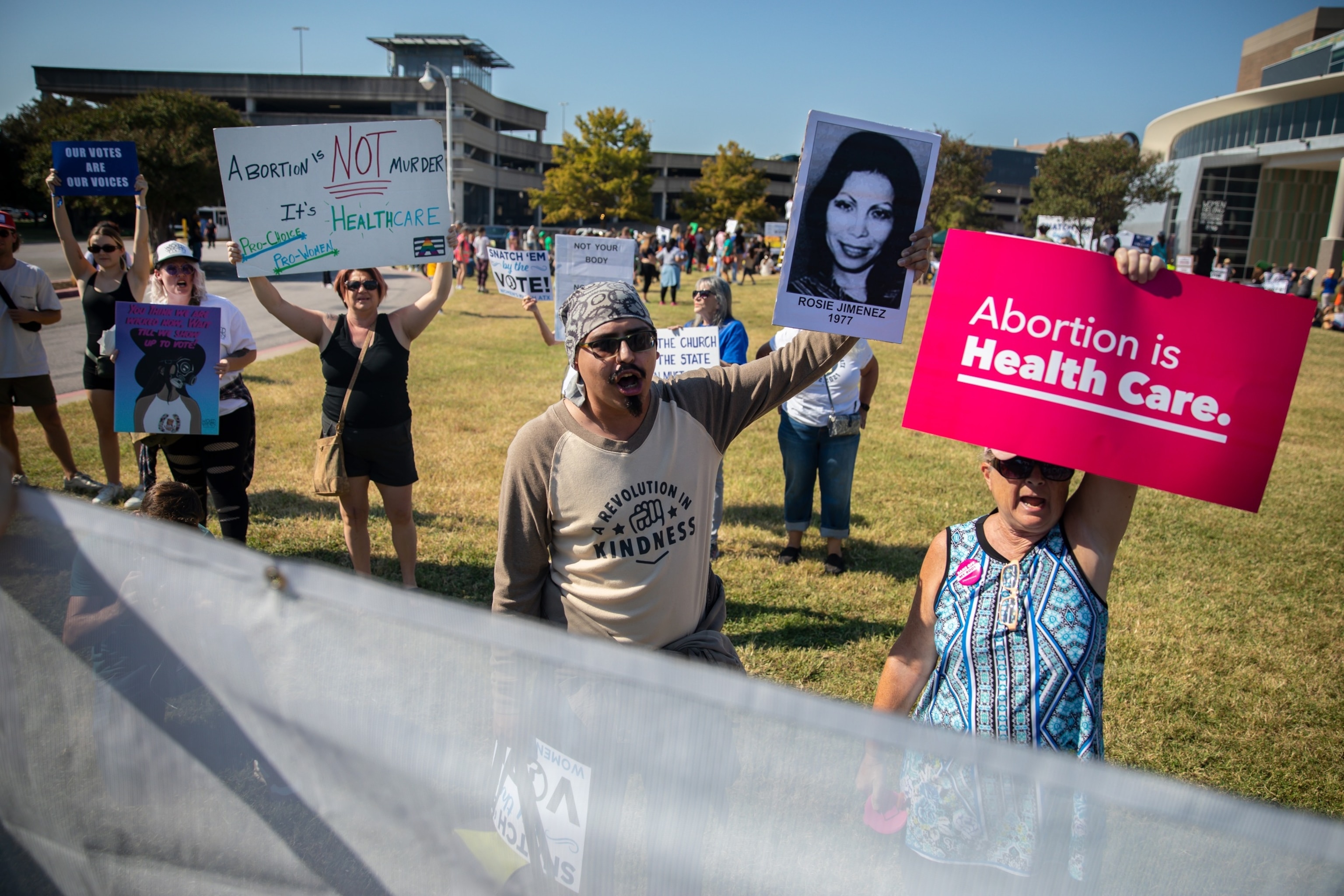 PHOTO: Abortion rights demonstrators chant and hold signs during a Women's March in Austin, Texas, Oct. 8, 2022.