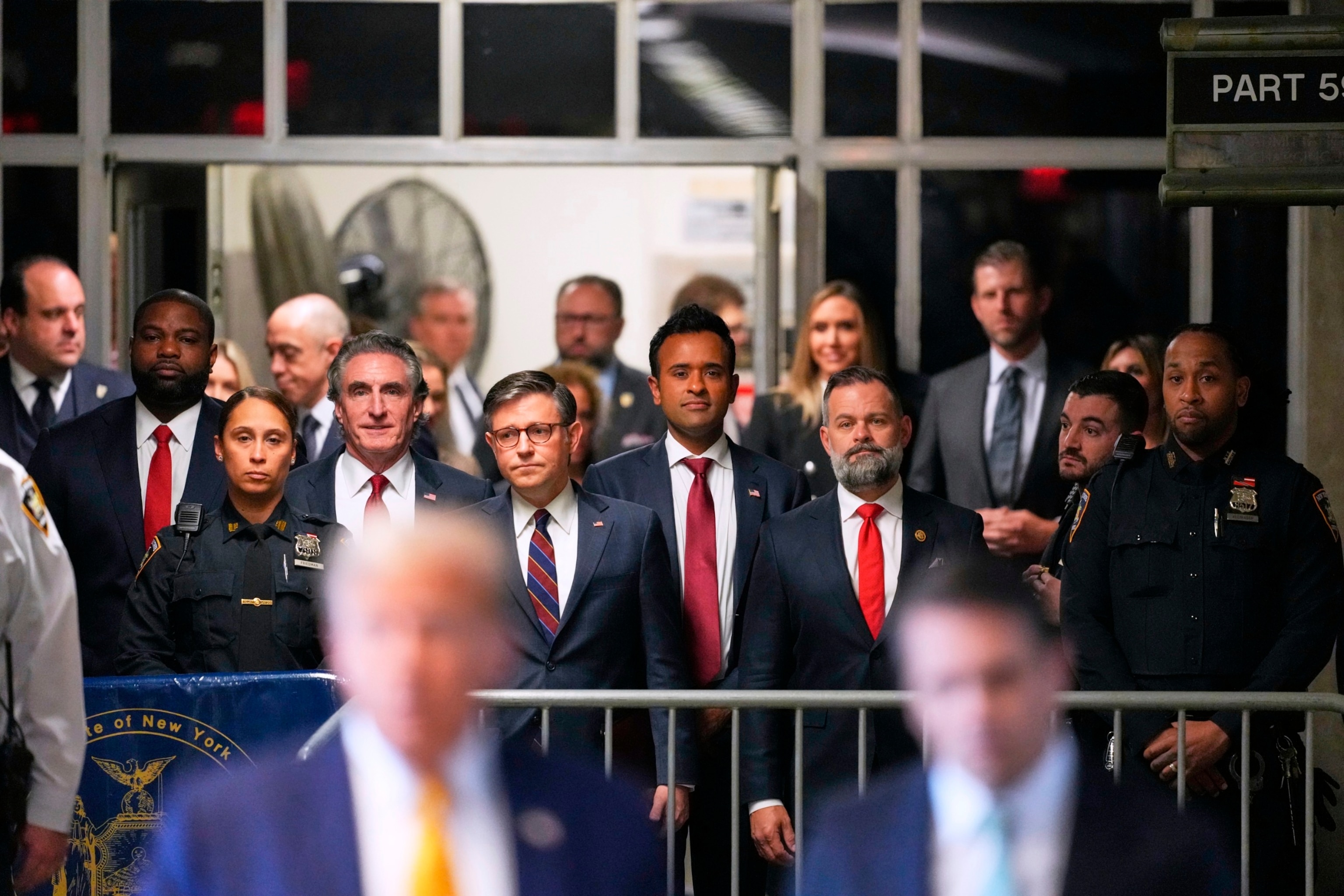 PHOTO: Doug Burgum, Speaker of the House Mike Johnson and Vivek Ramaswamy  look on as former President Donald Trump talks to the media outside Manhattan criminal court in New York, May 14, 2024. 