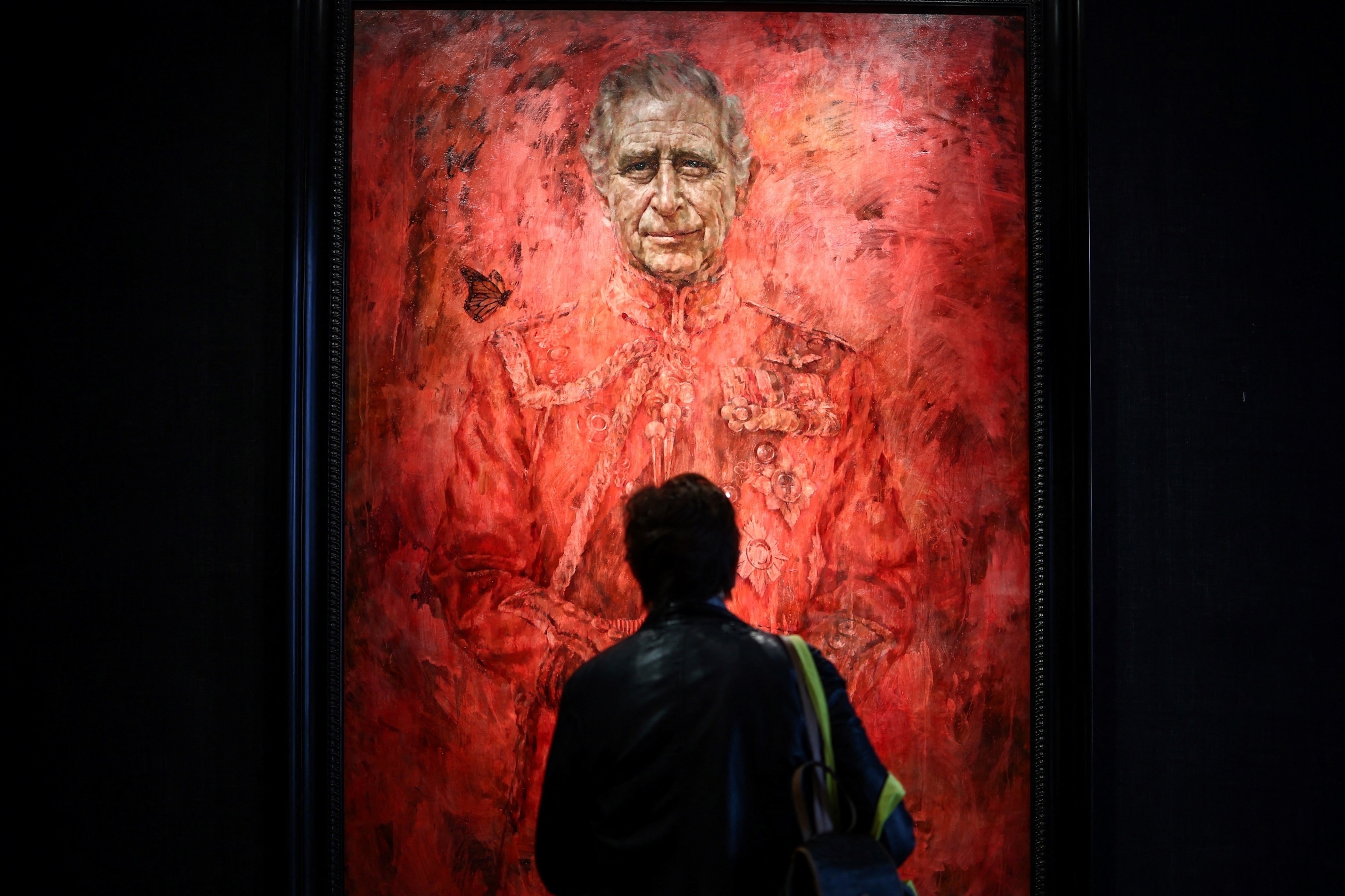 PHOTO: A visitor looks at the new official portrait of King Charles III, painted by British artist Jonathan Yeo, displayed at the Philip Mould gallery, on Pall Mall, central London, on May 16, 2024.