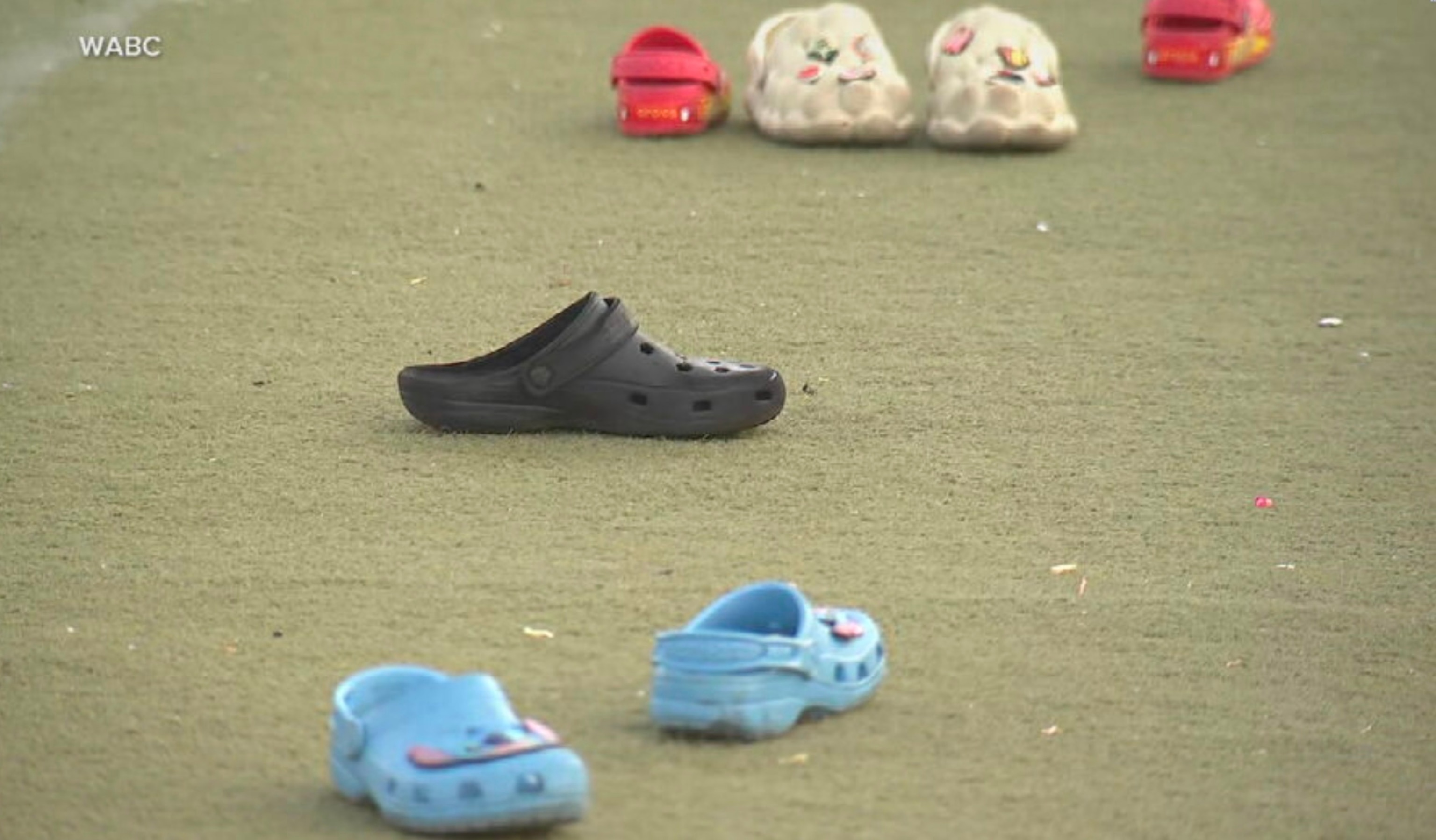 PHOTO: Several pairs of Crocs were left behind on a field at the Hilltop Playground in Brownsville, Brooklyn, including those worn by two children, ages 9 and 11, who were shot there on June 3, 2024.
