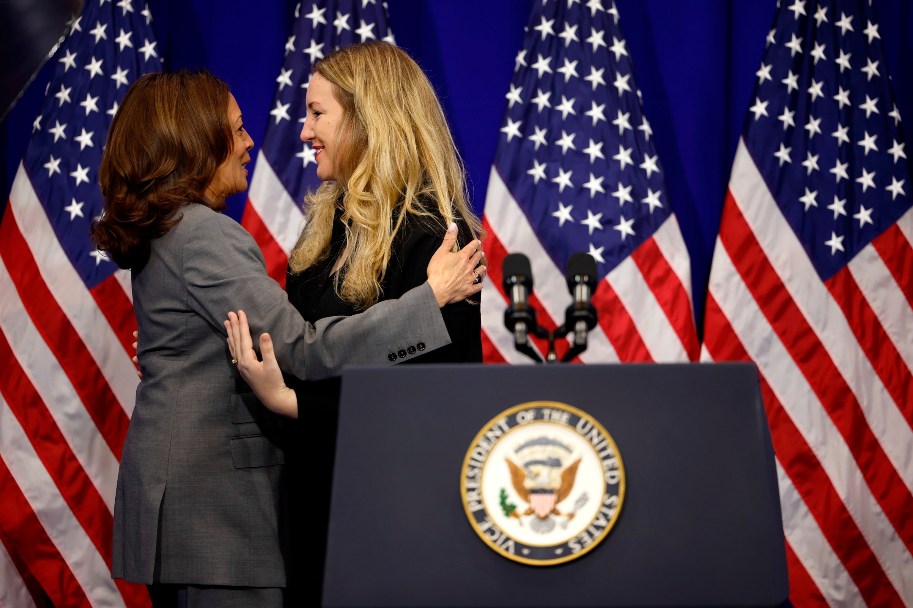 PHOTO: Vice President Kamala Harris embraces Kate Cox, the Texas woman who was denied an abortion last year, as she arrives on state to deliver deliver remarks on reproductive rights at the University of Maryland on June 24, 2024 in College Park, Md. 