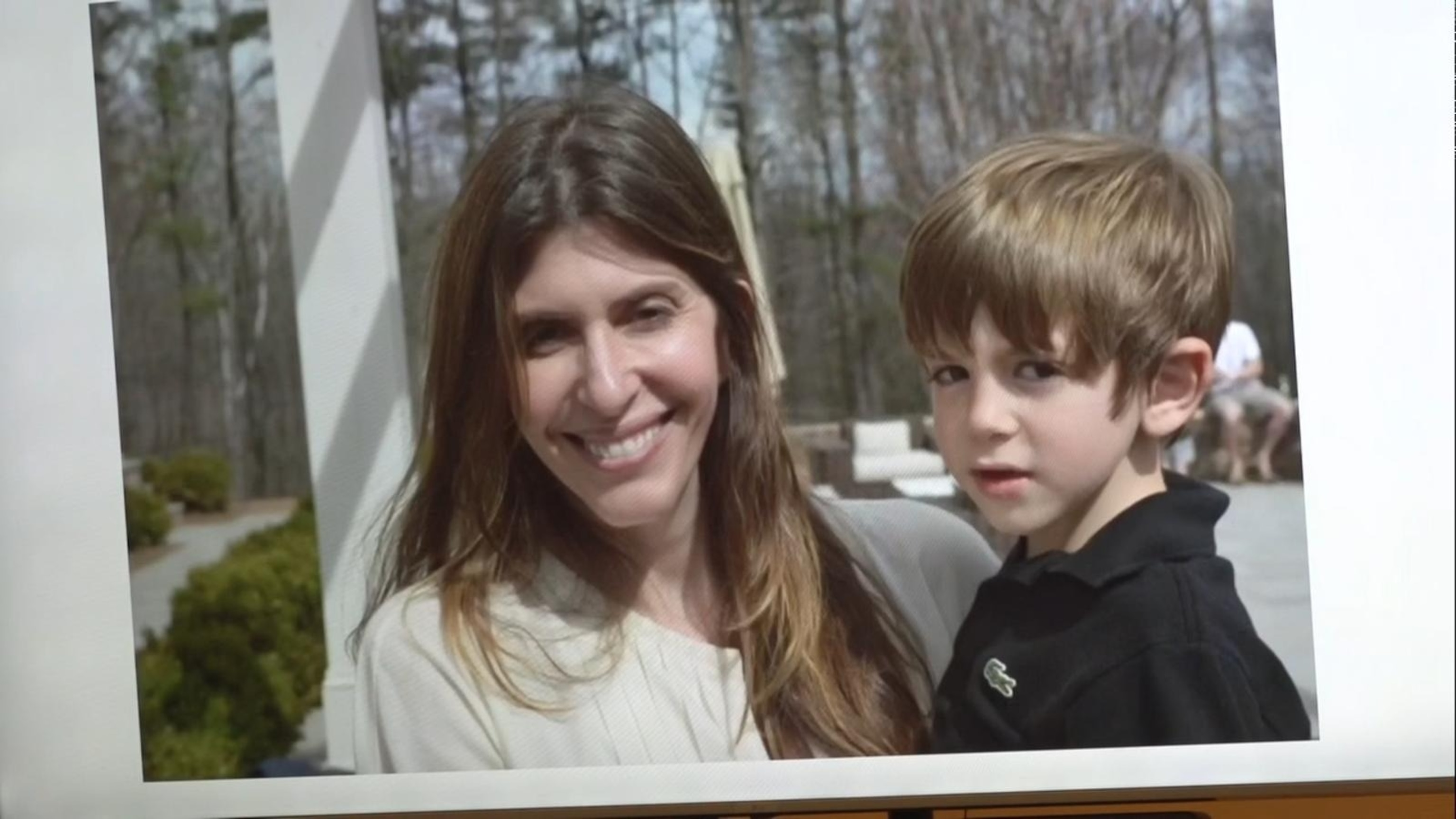 PHOTO: An undated photo of Jennifer Dulos and her son Petros is shown on the screen while Petros Dulos speaks during the sentencing for Michelle Troconis, May 31, 2024, in Stamford, Conn.