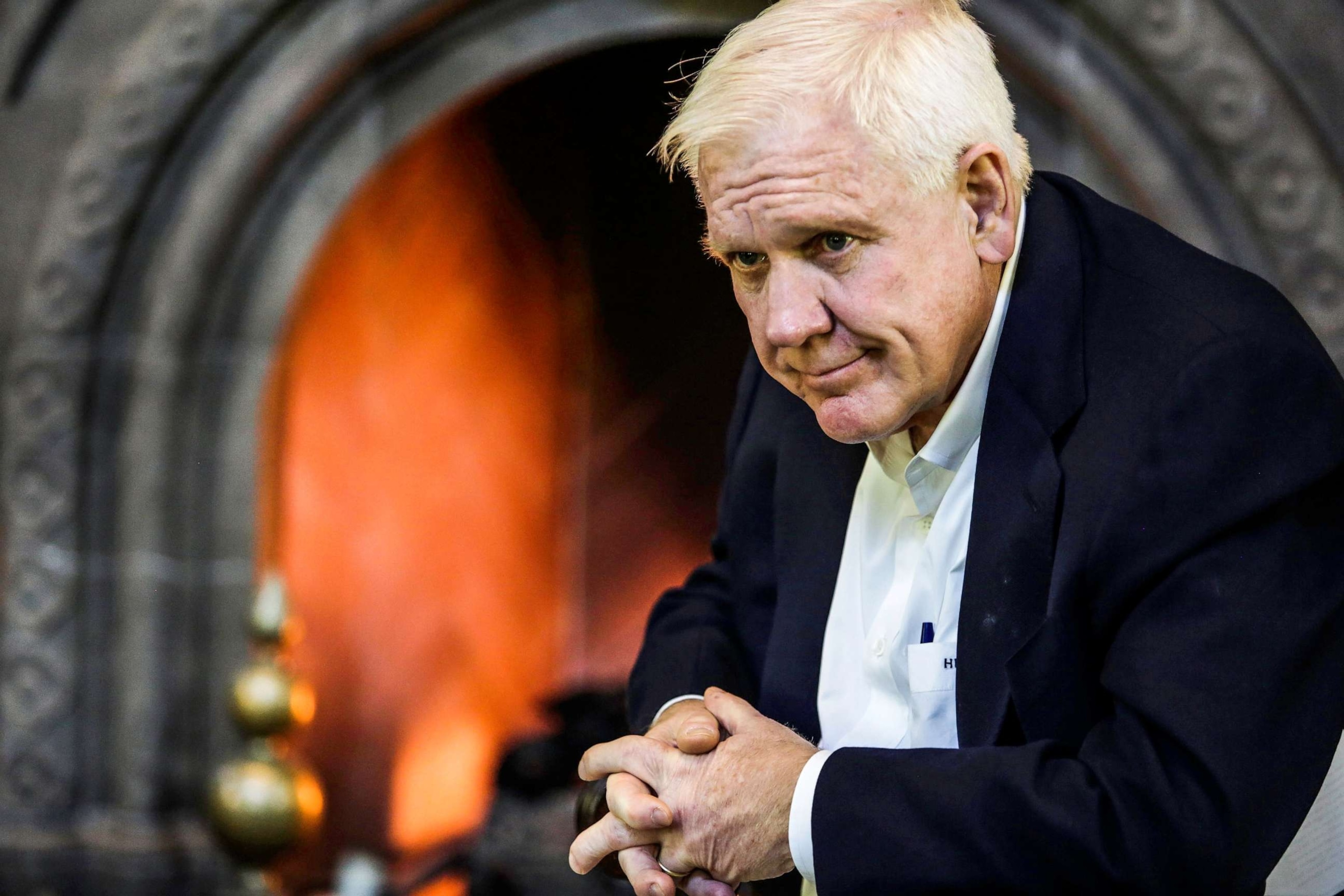 PHOTO: Harlan Crow, chairman and chief executive officer of Crow Holdings LLC, sits for a photograph at the Old Parkland estate offices in Dallas, Texas, Oct. 2, 2015.