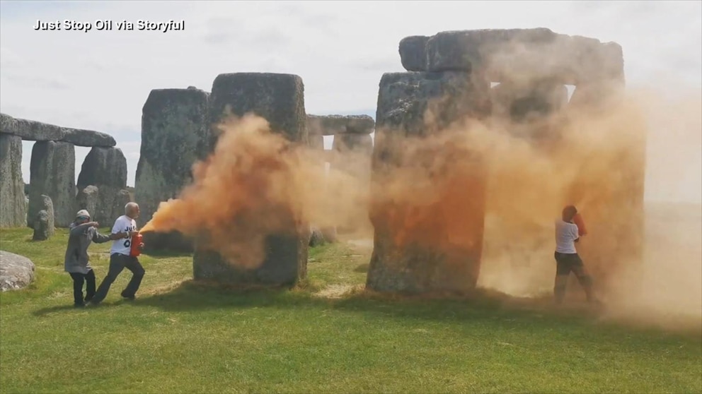 Environmental Protesters Use Orange Material to Make a Statement at Stonehenge in Britain