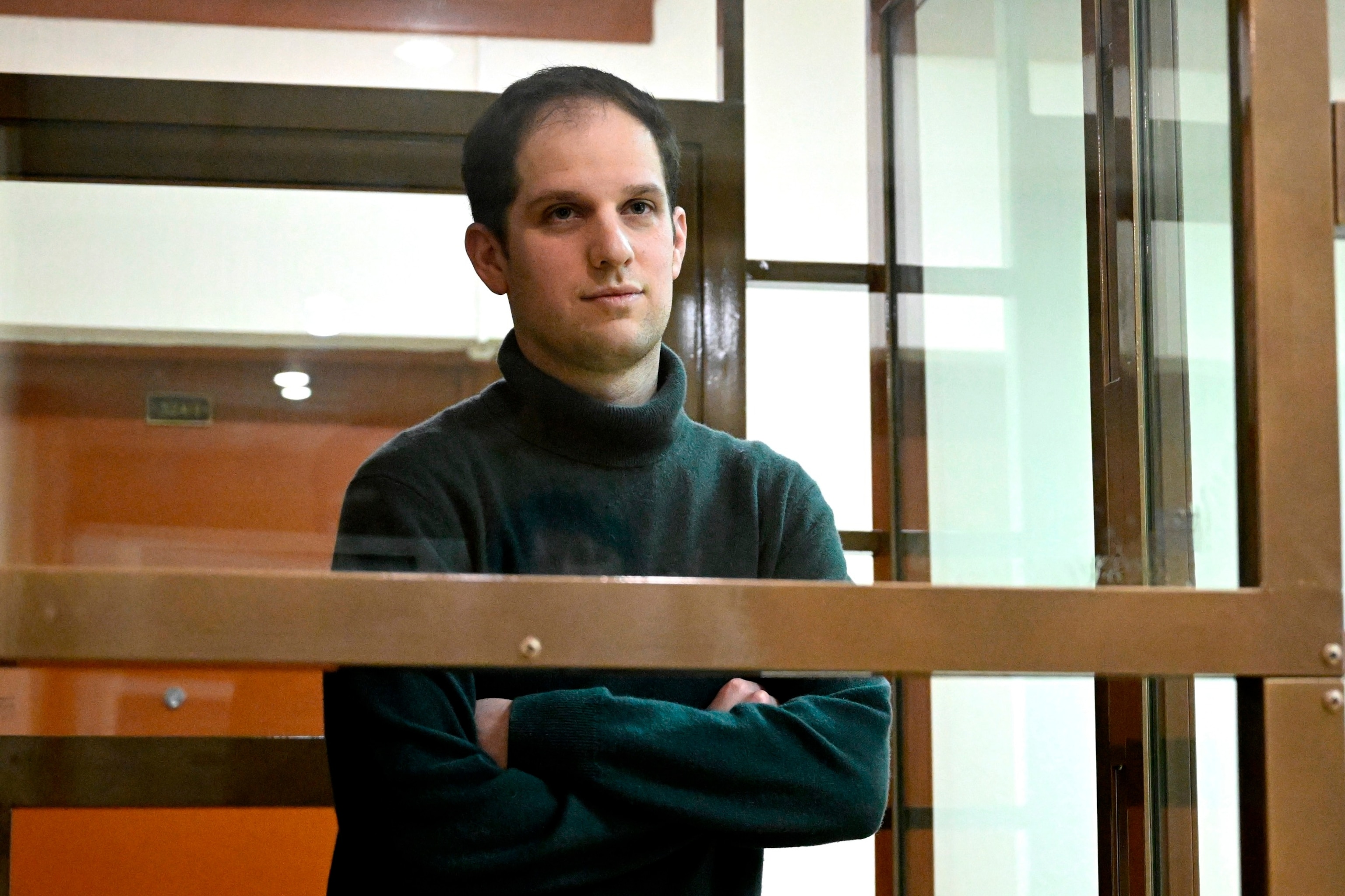 PHOTO: Wall Street Journal reporter Evan Gershkovich stands in a glass cage in a courtroom at the Moscow City Court, in Moscow, Dec. 14, 2023.