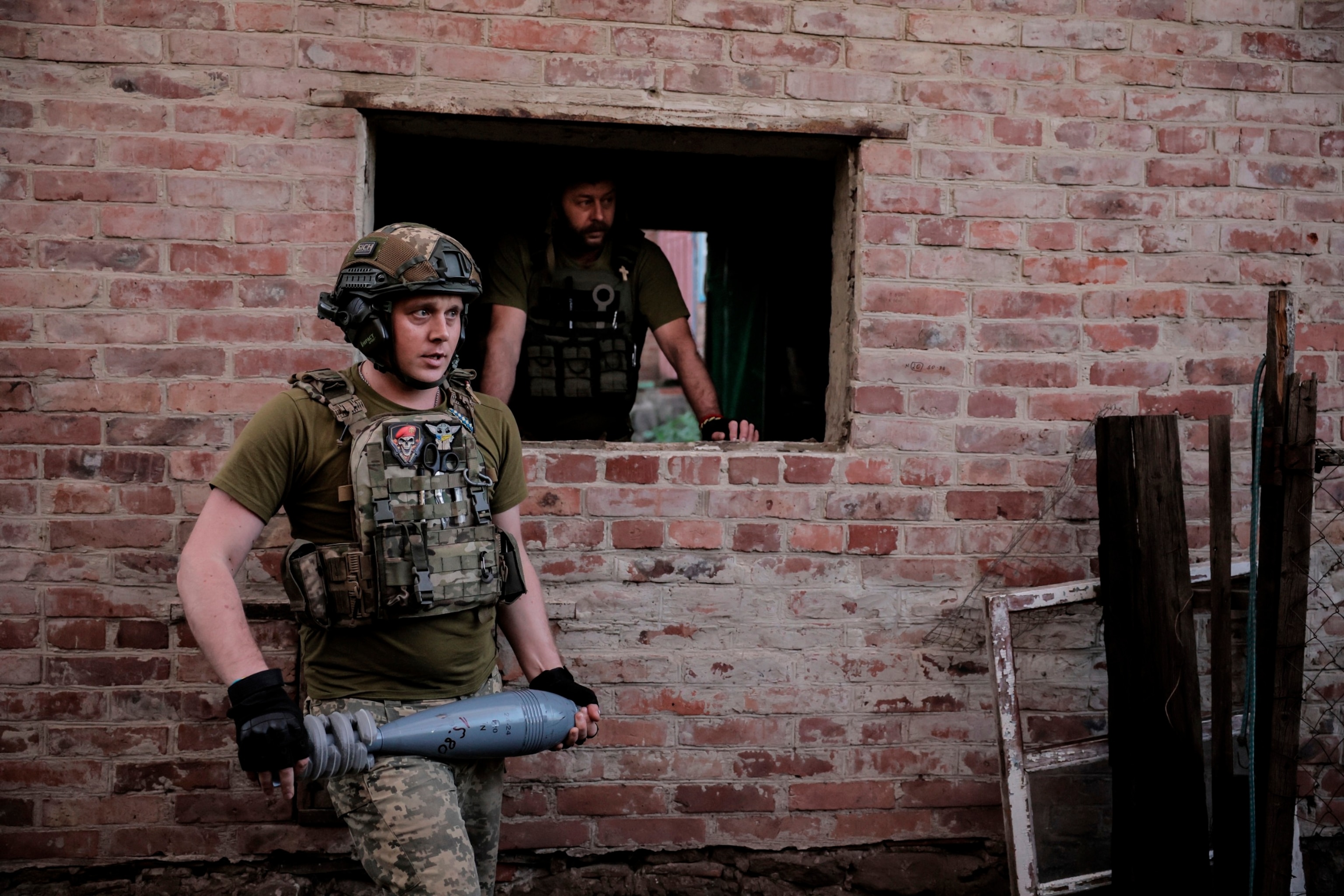 PHOTO: Ukrainian soldiers prepare to fire 120mm mortar towards Russian position on the front line at undisclosed location in Donetsk region, Ukraine, June 4, 2024. 