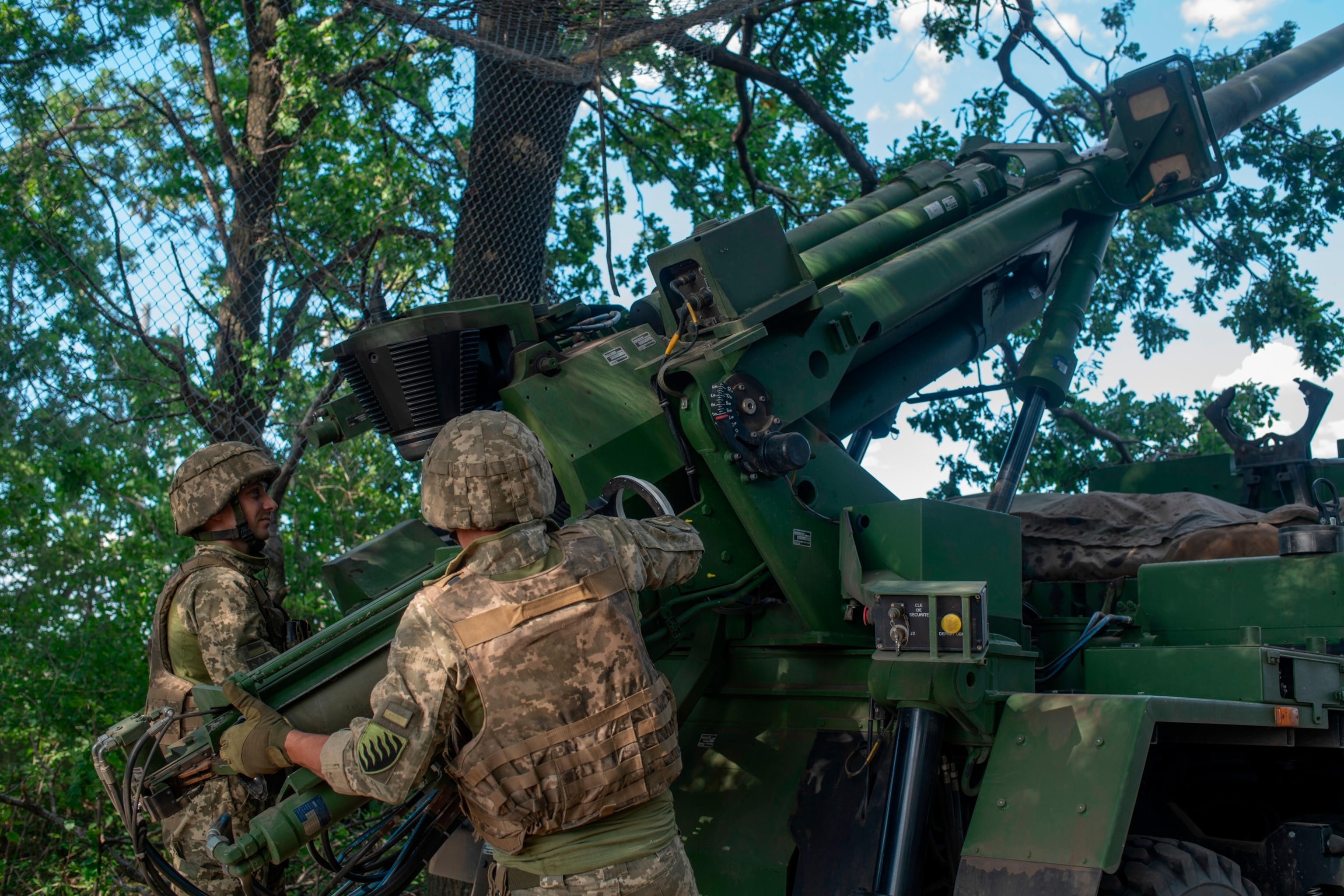 PHOTO: Ukrainian soldiers of the 55th Artillery Brigade load projectile into CAESAR self-propelled howitzer before firing on Russian position, June 1, 2024, in Donetsk Oblast, Ukraine. 